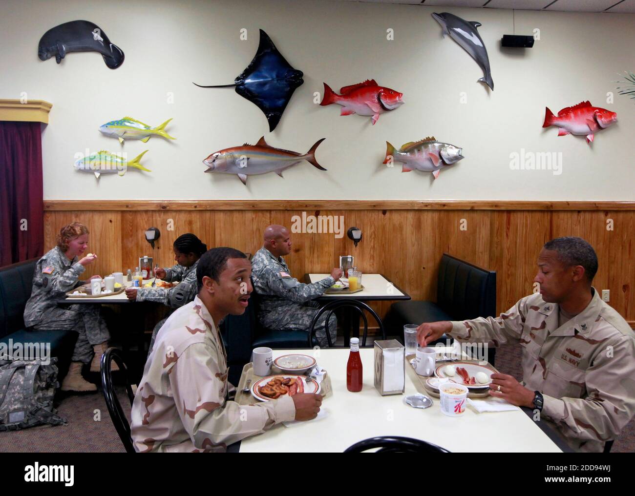 NO FILM, NO VIDEO, NO TV, NO DOCUMENTARY - Soldiers and sailors eat bacon-and-egg breakfasts beneath an aquatic motif at Gold Hill Galley, a cafeteria at the U.S. Navy base at Guantanamo Bay, Cuba on March 30, 2009. Photo by John VanBeekum/Miami Herald/MCT/ABACAPRESS.COM Stock Photo