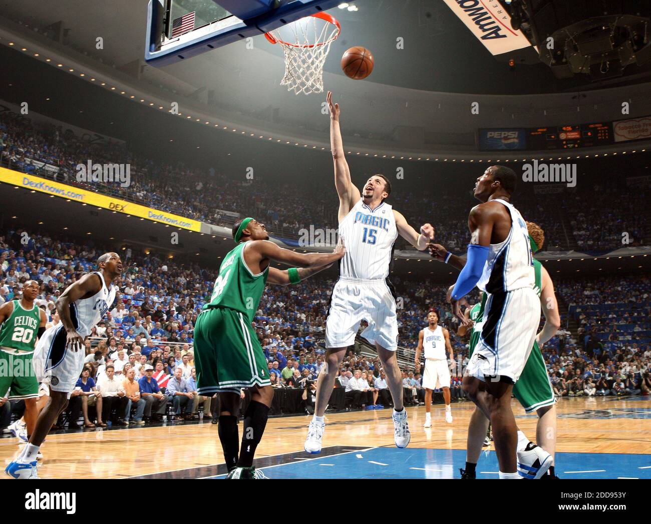 Orlando Magic players Hedo Turkoglu (15), Dwight Howard (12) and Rashard  Lewis celebrate during a 91-78 win against the Philadelphia 76ers in Game 5  of the NBA playoffs at Amway Arena in