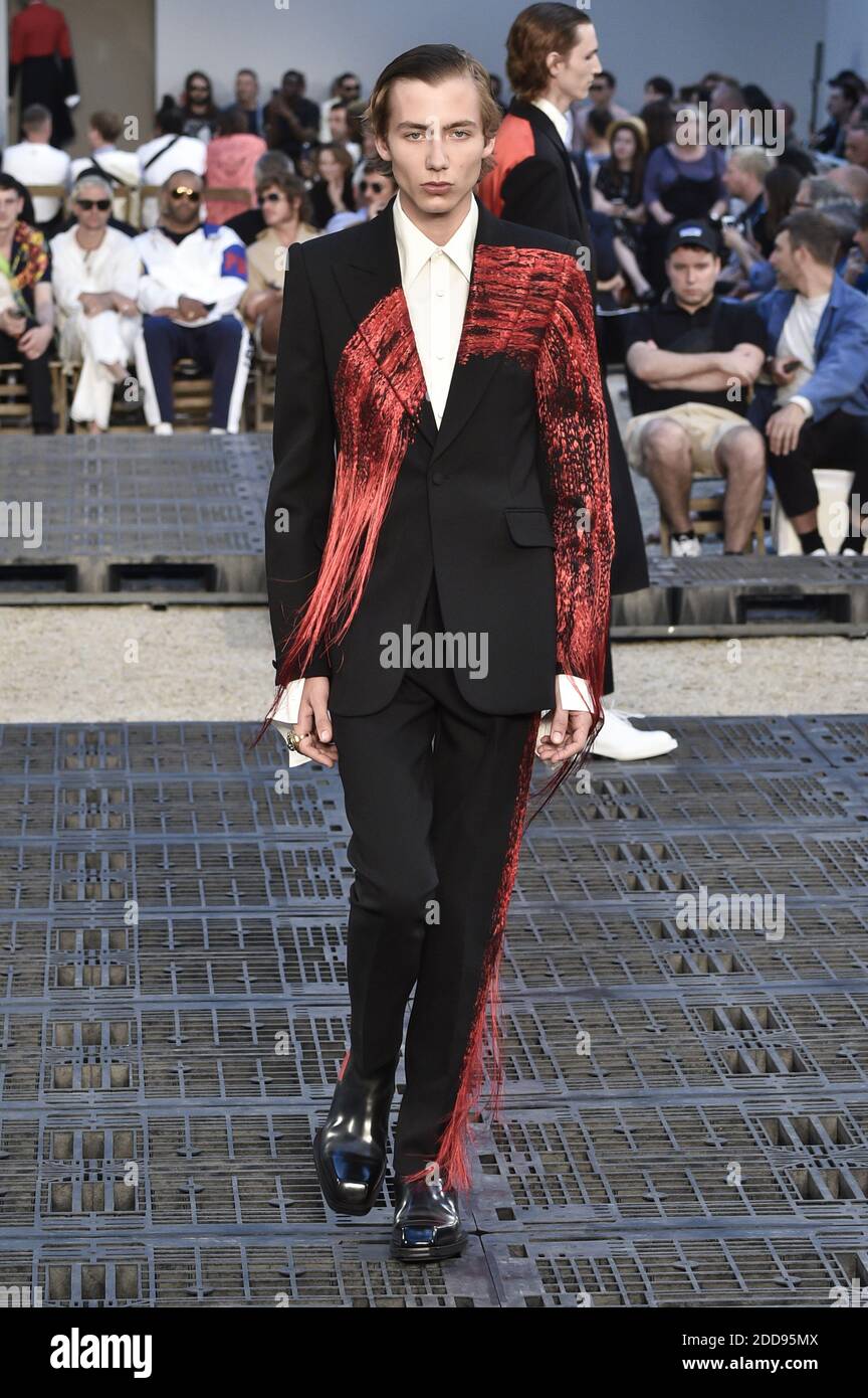 A model walks the runway during the Alexander McQueen Menswear