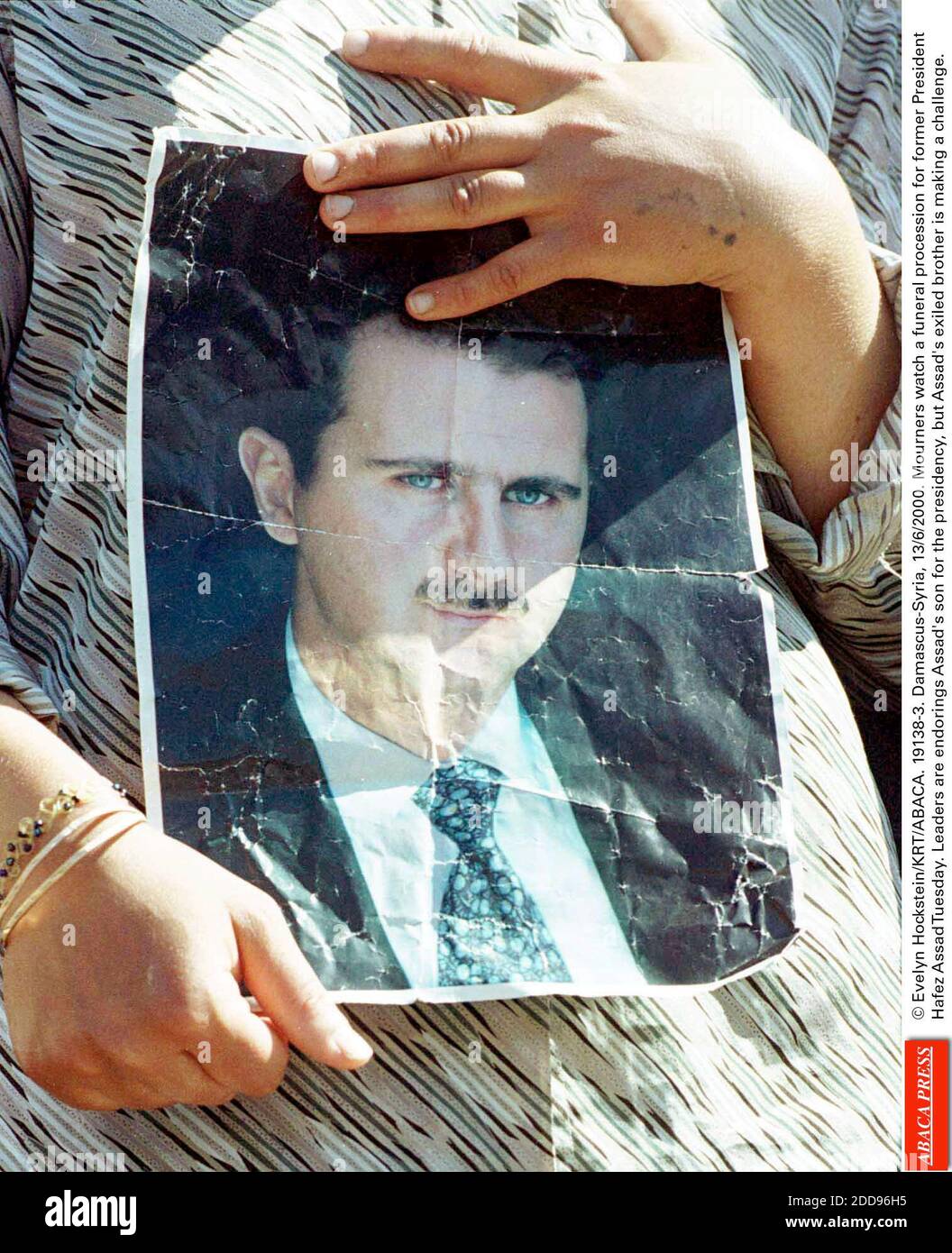 NO FILM, NO VIDEO, NO TV, NO DOCUMENTARY - © Evelyn Hockstein/KRT/ABACA. 19138-3. Damascus-Syria, 13/6/2000. Mourners watch a funeral procession for former President Hafez Al Assad Tuesday. Leaders are endorings Assad's son for the presidency, but Assad's exiled brother is making a challenge. Pict Stock Photo
