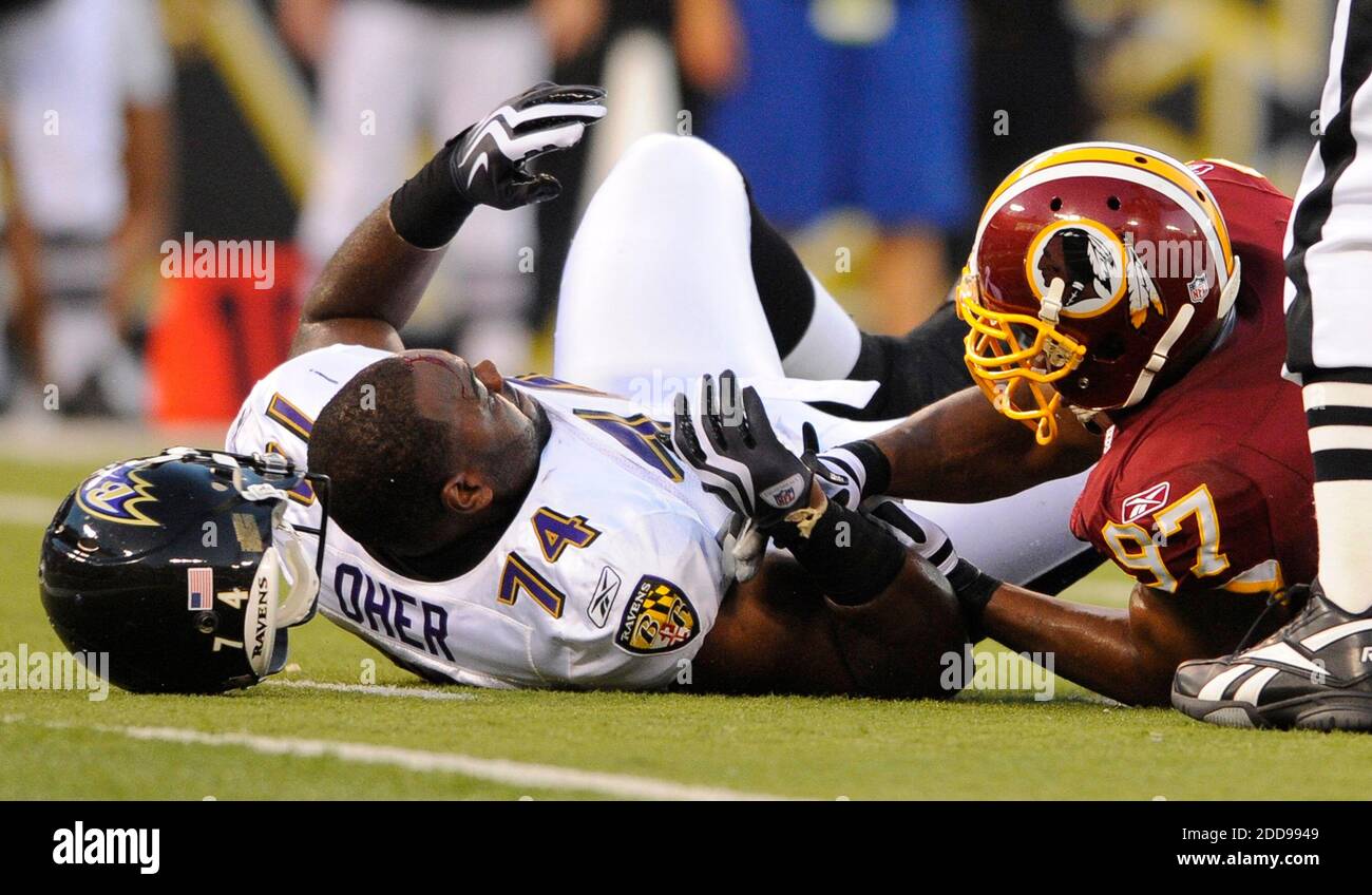 NO FILM, NO VIDEO, NO TV, NO DOCUMENTARY - Baltimore Ravens Michael Oher  has his helmet knocked off and a gash on his head after being taken down by  Washington Redskins Renaldo