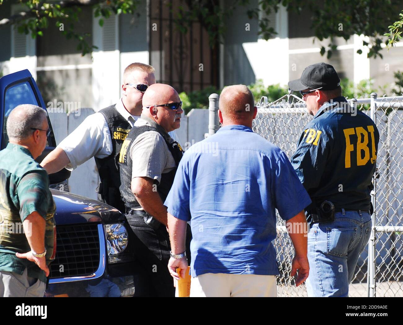 NO FILM, NO VIDEO, NO TV, NO DOCUMENTARY FBI agents and sheriff's