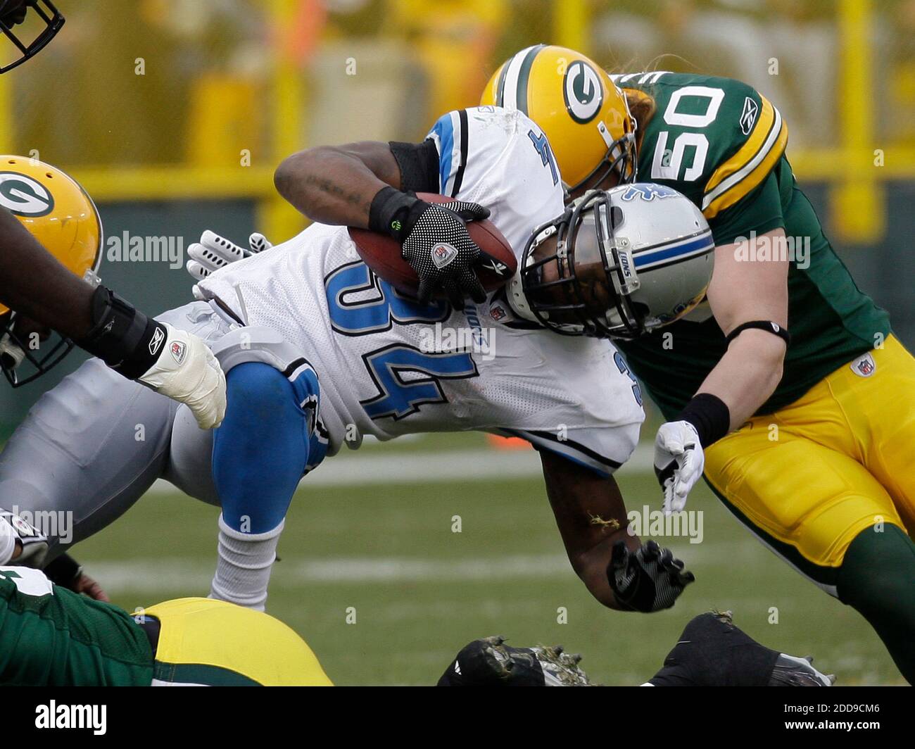 NO FILM, NO VIDEO, NO TV, NO DOCUMENTARY - Green Bay Packers' A.J. Hawk  stops Detroit Lions' Kevin Smith during an NFL football game in Green Bay,  WI, USA on October 18,