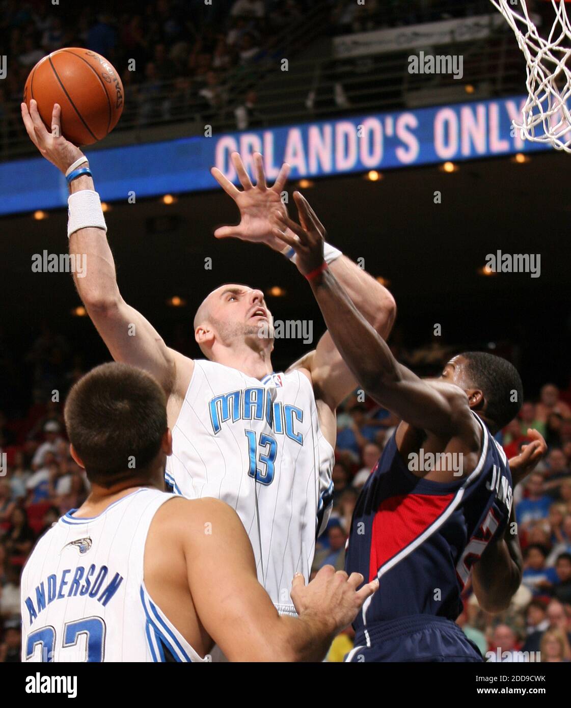 NO FILM, NO VIDEO, NO TV, NO DOCUMENTARY - Orlando Magic center Marcin Gortat (13) shoots over Atlanta Hawks guard Joe Johnson during preseason action at Amway Arena in Orlando, FL, USA on October 23, 2009. The Magic defeated the Hawks, 123-86. Photo by Stephen M. Dowell/Orlando Sentinel/MCT/Cameleon/ABACAPRESS.COM Stock Photo