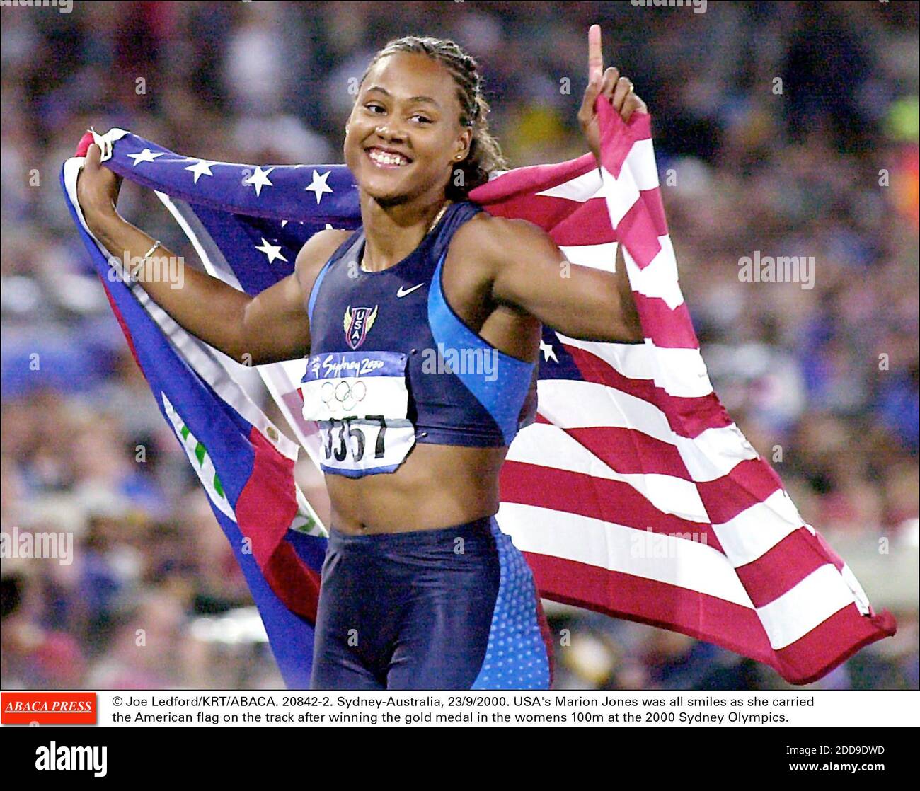 Marion Jones smiles after winning the women's 100-meter dash