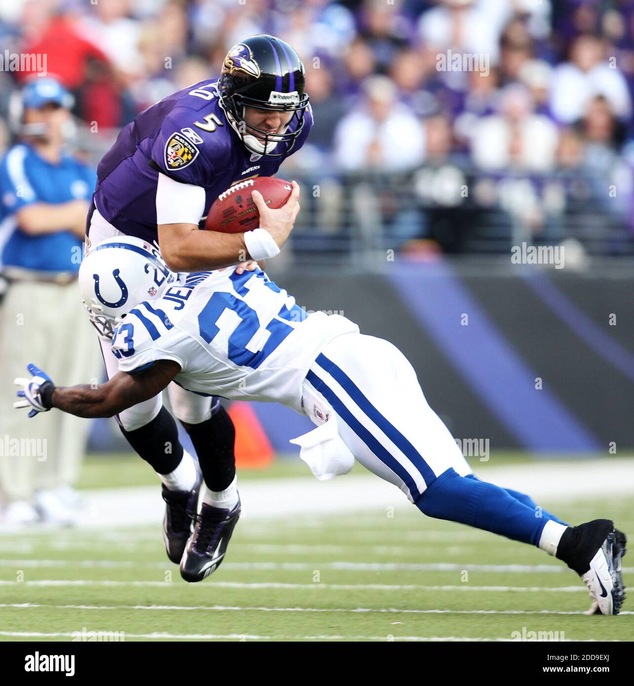 NO FILM, NO VIDEO, NO TV, NO DOCUMENTARY - Quarterback Joe Flacco of the Baltimore Ravens (5) is tackled by Tim Jennings of the Indianapolis Colts (23) in the second half of their game in Baltimore, MD, USA on November 22, 2009. Photo by George Bridges/MCT/Cameleon/ABACAPRESS.COM Stock Photo