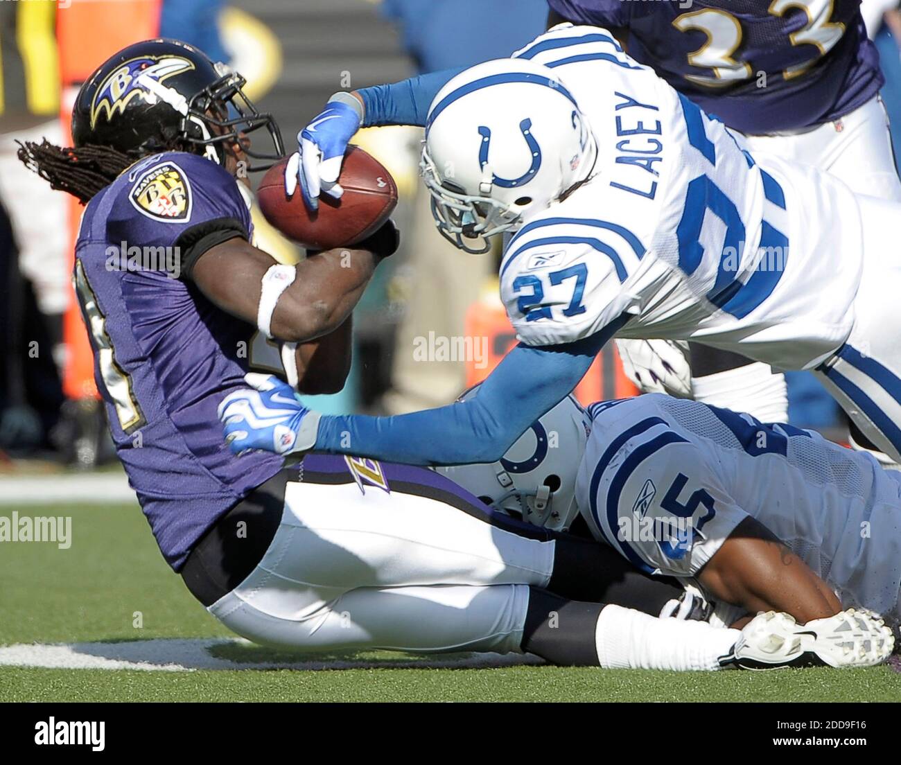NO FILM, NO VIDEO, NO TV, NO DOCUMENTARY - Indianapolis Colts cornerback Jacob Lacey (27) strips the ball from Baltimore Ravens cornerback Lardarius Webb (21) as he falls in the first quarter of play in Baltimore, MD, USA on November 22, 2009. The Colts defeated the Ravens 17-15. Photo by Karl Merton Ferron/Baltimore Sun/MCT/Cameleon/ABACAPRESS/COM Stock Photo