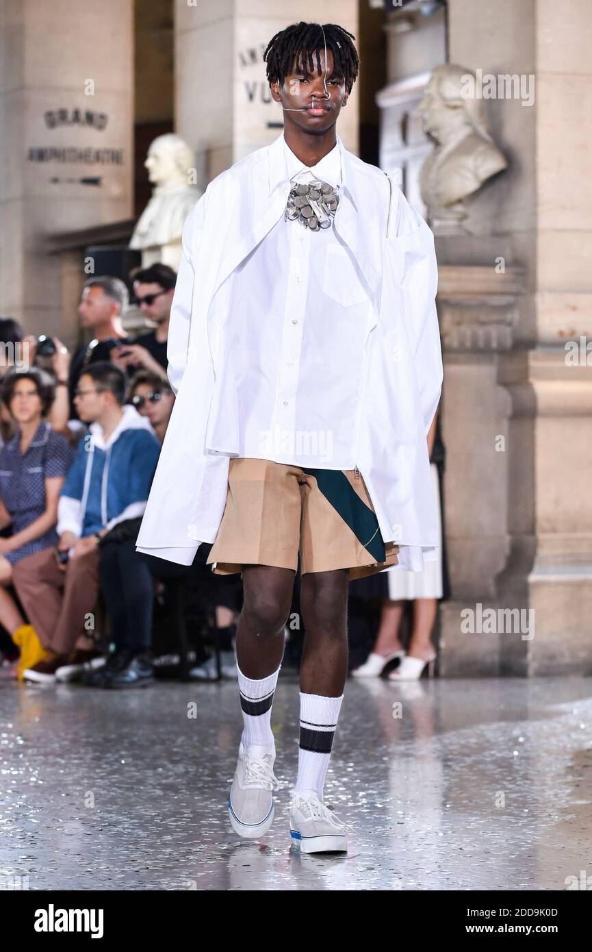 A model walks the runway during the Facetasm Menswear Spring