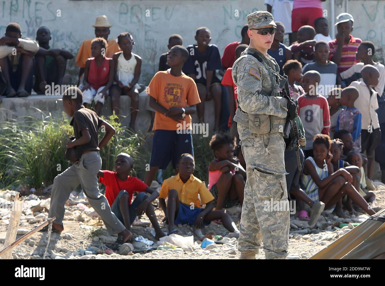 No Film No Video No Tv No Documentary U S Army Spc Talon Armor Stands By As Security As Hundreds Of Haitians Line Up At A Food Distribution To The People In