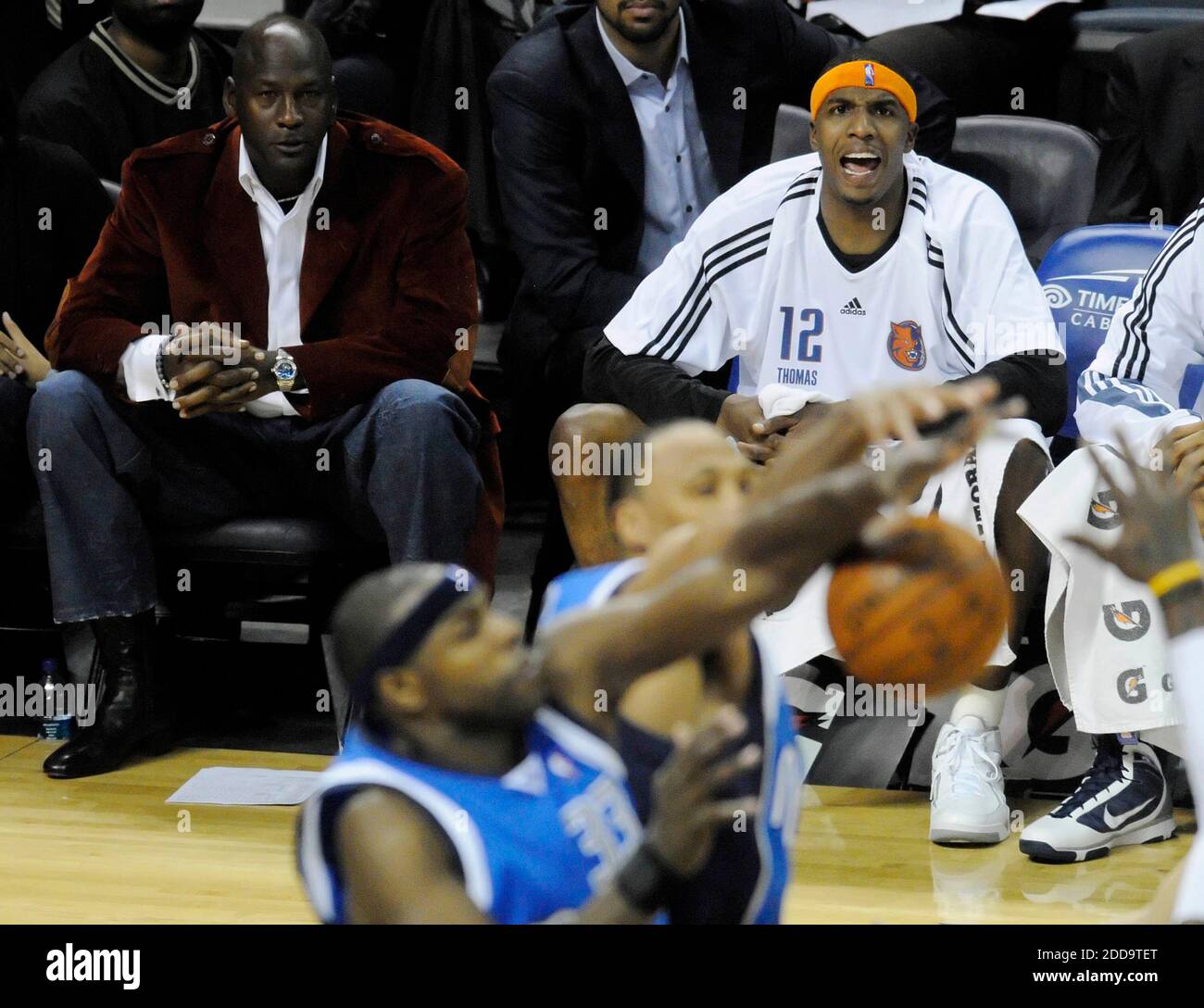 NO FILM, NO VIDEO, NO TV, NO DOCUMENTARY - Charlotte Bobcats managing partner Michael Jordan (left) watches the game against the Dallas Mavericks as the Bobcats' Tyrus Thomas (12) yells toward the court during NBA Basketball match, Dallas Mavericks vs Charlotte Bobcats at Time Warner Cable Arena in Charlotte in North Carolina, USA on March 1, 2010. Dallas Mavericks won 89-84. Photo by David T. Foster III/MCT/Cameleon/ABACAPRESS.COM Stock Photo