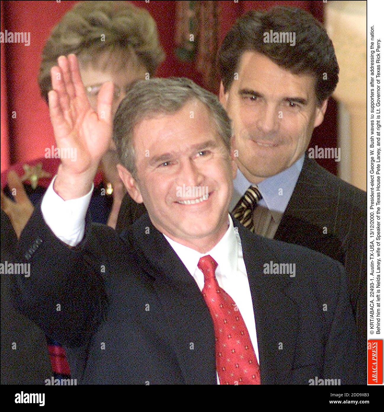NO FILM, NO VIDEO, NO TV, NO DOCUMENTARY - © KRT/ABACA. 22493-1. Austin-TX-USA, 13/12/2000. President-elect George W. Bush waves to supporters after addressing the nation. Behind him at left is Nelda Laney, wife of Speaker of the Texas House Pete Laney, and at right is Lt. Governor of Texas Rick P Stock Photo