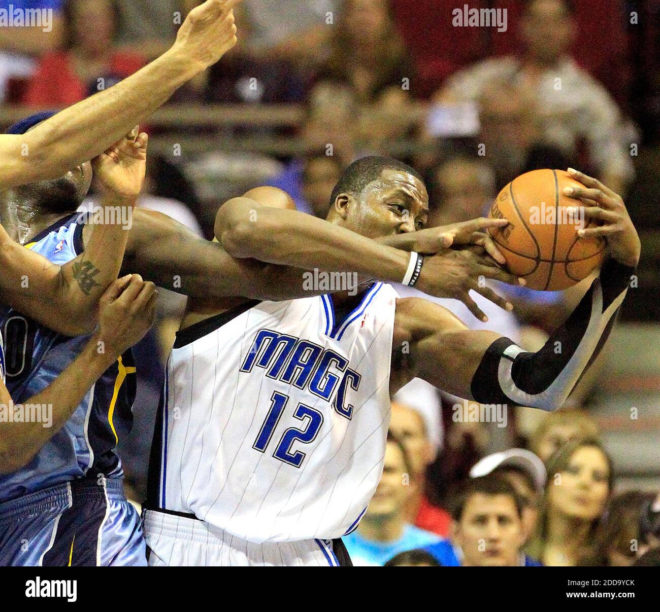 NO FILM, NO VIDEO, NO TV, NO DOCUMENTARY - Orlando Magic center Dwight Howard (12) pulls a rebound away from Memphis Grizzlies forward Zach Randolph, left, during an NBA game at Amway Arena in Orlando, FL, USA on April 4, 2010. Photo by Stephen M. Dowell/Orlando Sentinel/MCT/Cameleon/ABACAPRESS.COM Stock Photo