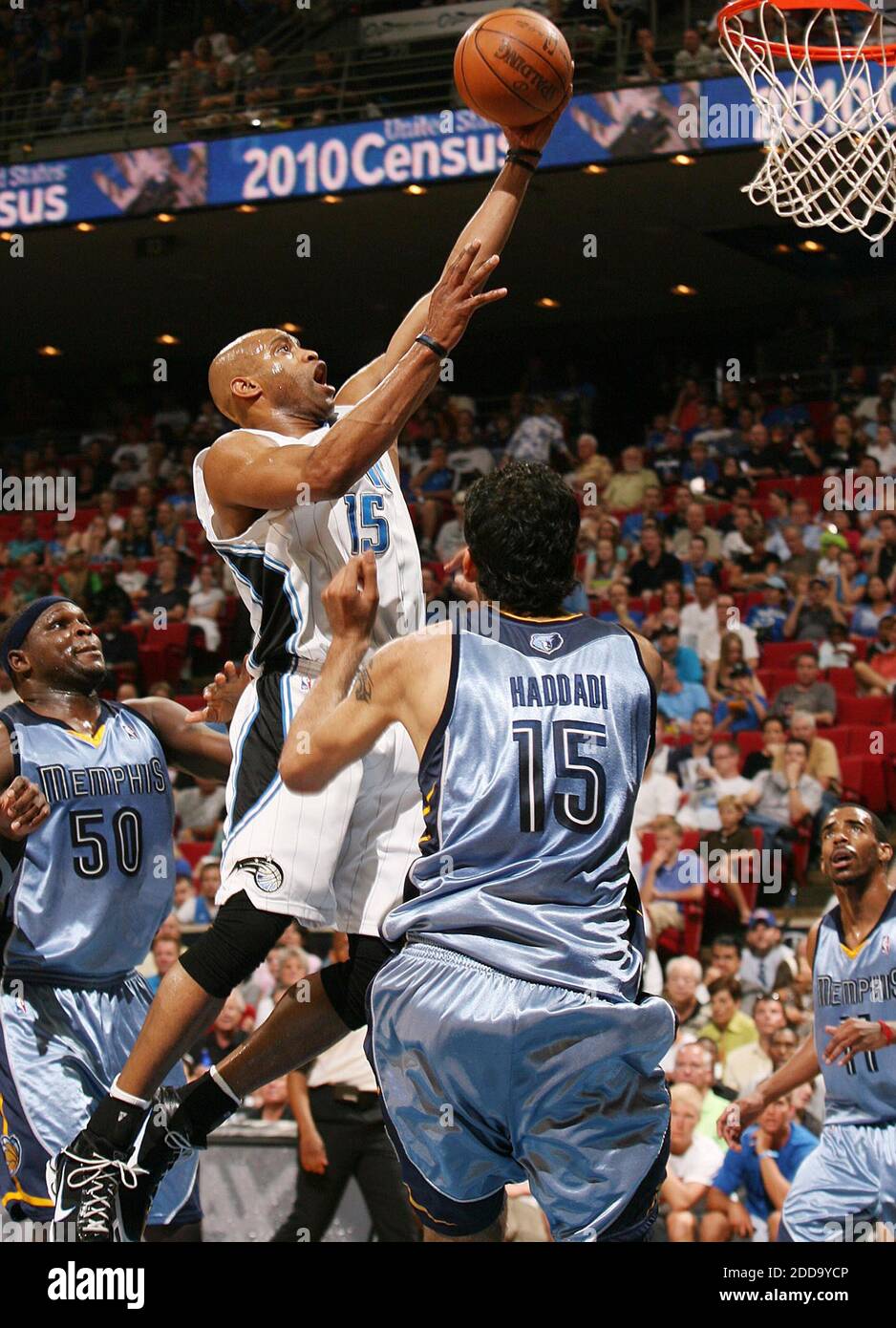 NO FILM, NO VIDEO, NO TV, NO DOCUMENTARY - Orlando Magic guard Vince Carter scores over Memphis Grizzlies center Hamed Haddadi and forward Zach Randolph (50) during an NBA game at Amway Arena in Orlando, FL, USA on April 4, 2010. Photo by Stephen M. Dowell/Orlando Sentinel/MCT/Cameleon/ABACAPRESS.COM Stock Photo