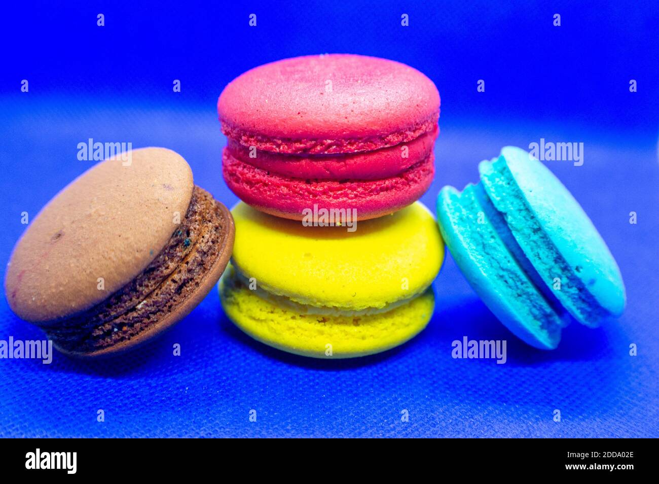 Almond macaroni cookies on a blue background.Bright color Stock Photo