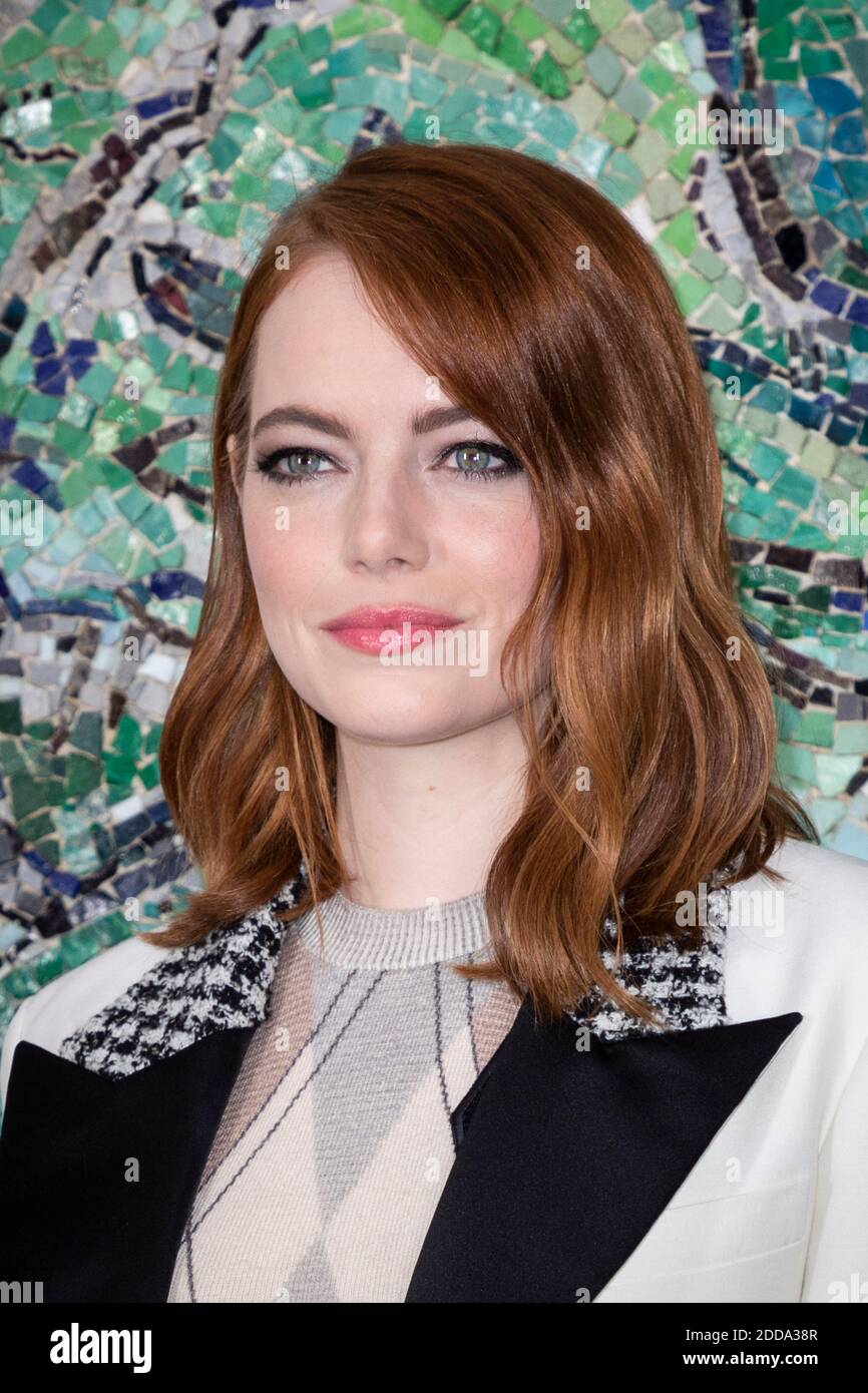 Emma Stone poses at the photocall for Louis Vuitton Cruise