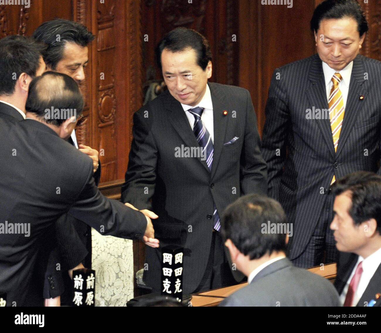 NO FILM, NO VIDEO, NO TV, NO DOCUMENTARY - Naoto Kan shakes hands with another party member after being elected prime minister at a plenary session of the House of Representatives on Friday afternoon, June 4, 2010. On Kan's right is outgoing Prime Minister Yukio Hatoyama. Photo by Yomiuri Shimbun/MCT/ABACAPRESS.COM Stock Photo