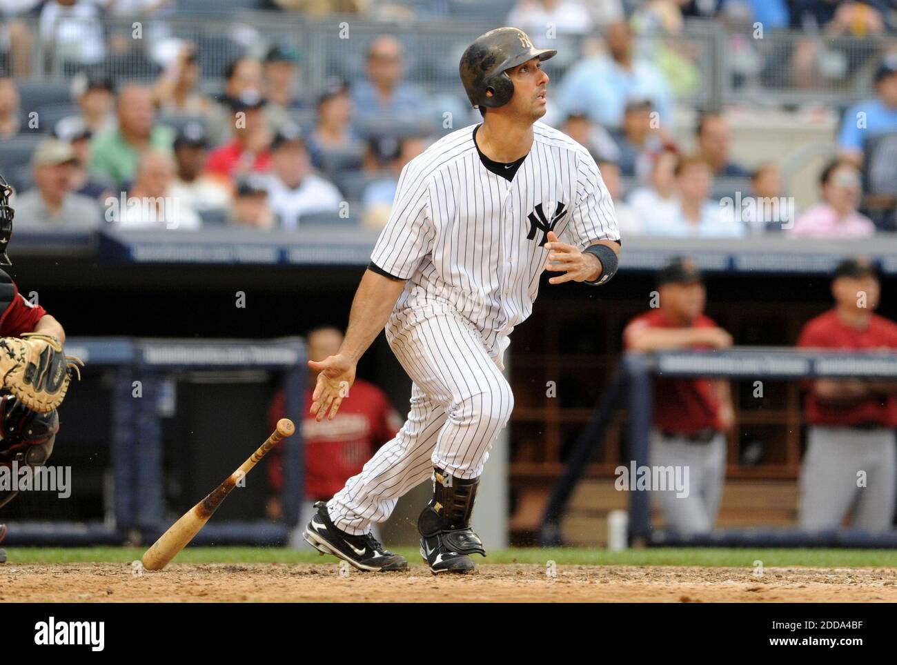 Jorge Posada puts his hand on the back of Yogi Bera at Yankee