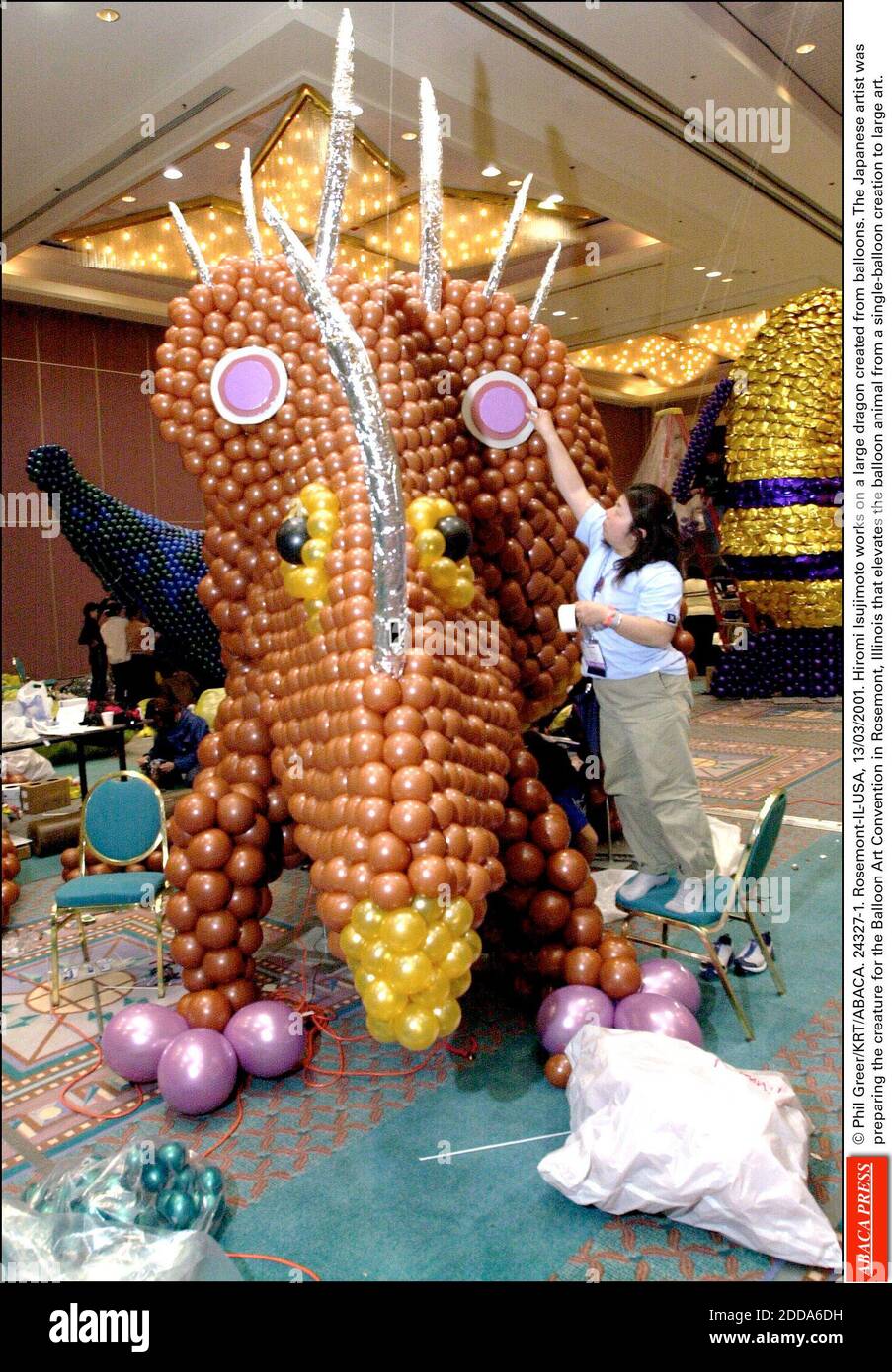 NO FILM, NO VIDEO, NO TV, NO DOCUMENTARY - © Phil Greer/KRT/ABACA. 24327-1.  Rosemont-IL-USA, 13/03/2001. Hiromi Isujimoto works on a large dragon  created from balloons. The Japanese artist was preparing the creature