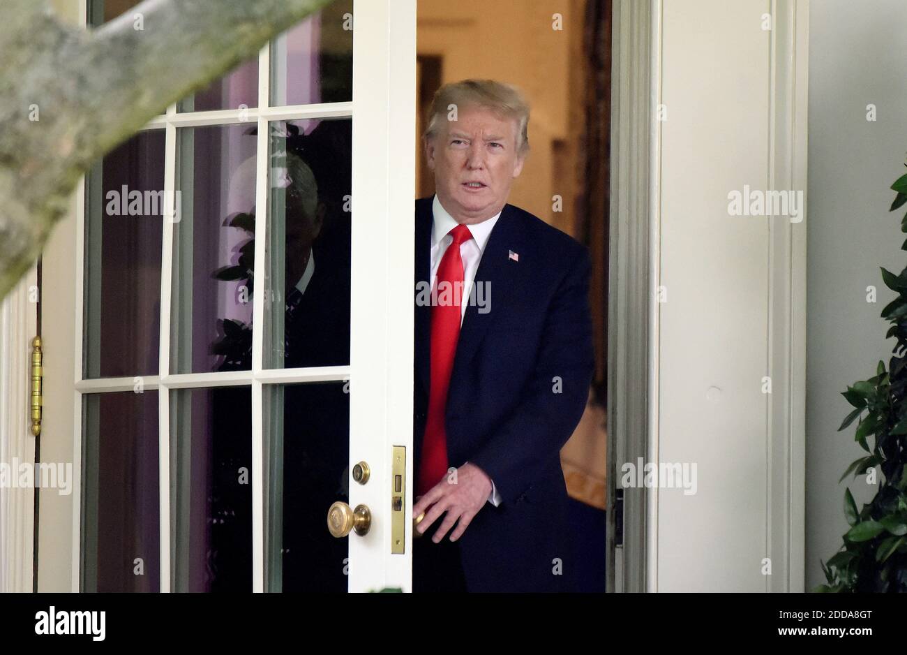 U.S. President Donald Trump walks out of the Oval Office before ...
