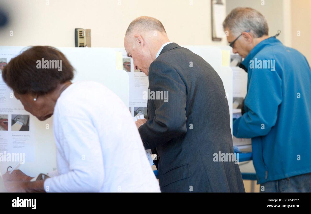 NO FILM, NO VIDEO, NO TV, NO DOCUMENTARY - Democratic gubernatorial candidate Jerry Brown, left, places his vote at Oakland Fire Station 6 on Tuesday, November 2, 2010 in Oakland, California. Photo by Hector Azumeca/Sacramento Bee/MCT/ABACAPRESS.COM Stock Photo