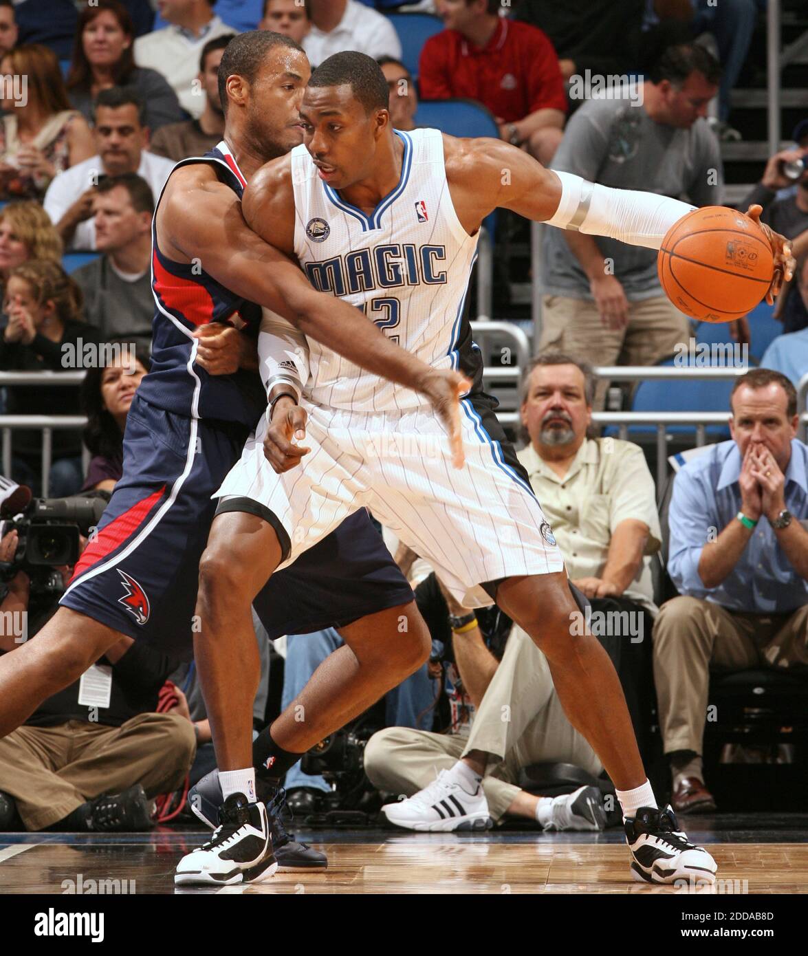 no-film-no-video-no-tv-no-documentary-orlando-center-dwight-howard-12-posts-up-against-atlanta-center-jason-collins-34-during-the-nba-basketball-match-orlando-magic-vs-atlanta-hawks-at-amway-center-in-orlando-fl-usa-on-november-8-2010-orlando-magic-won-93-89-photo-by-gary-w-greenorlando-sentinelmctabacapresscom-2DDAB8D.jpg