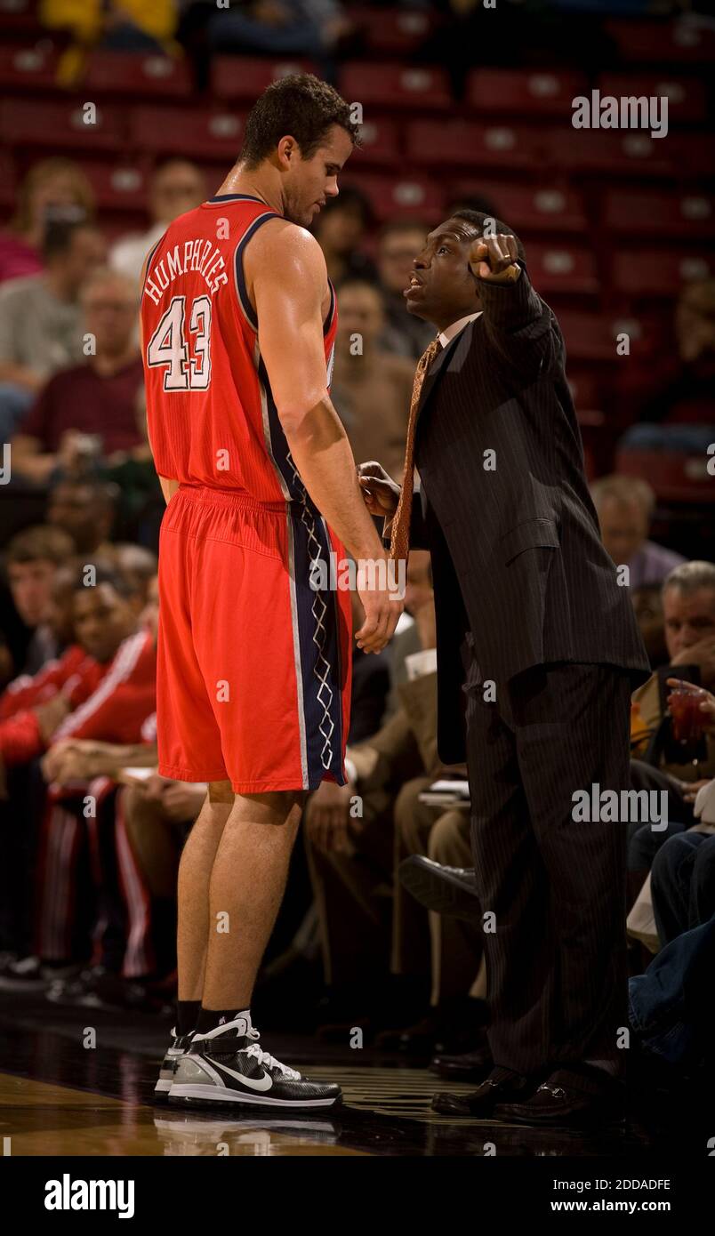 NO FILM, NO VIDEO, NO TV, NO DOCUMENTARY - New Jersey Nets head coach Avery  Johnson, right, makes a point to Kris Humphries after being replaced in the  first quarter during the