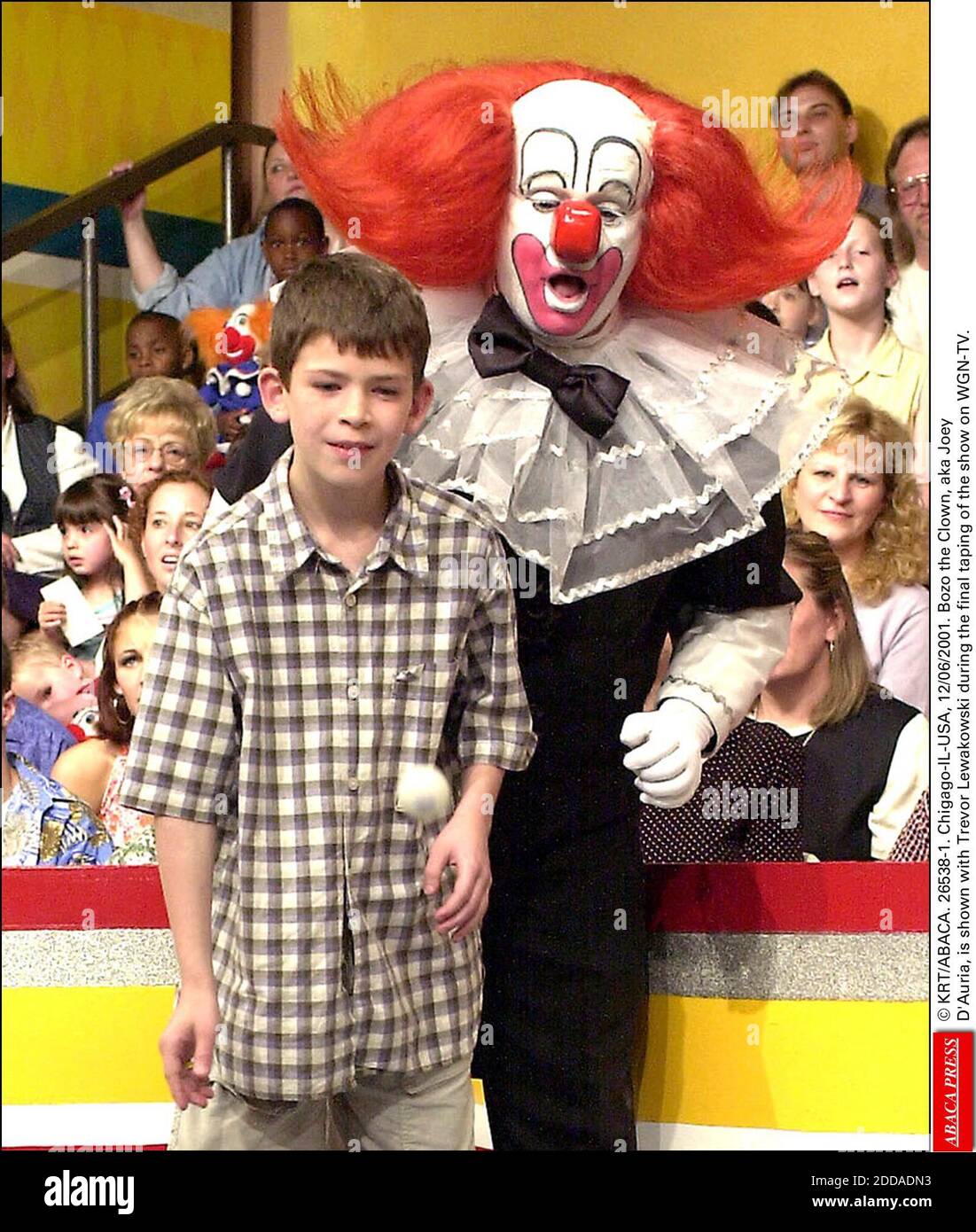 NO FILM, NO VIDEO, NO TV, NO DOCUMENTARY - © KRT/ABACA. 26538-1. Chicago-IL-USA, 12/06/2001. Bozo the Clown, aka Joey D'Auria, is shown with Trevor Lewakowski during the final taping of the show on WGN-TV. Stock Photo