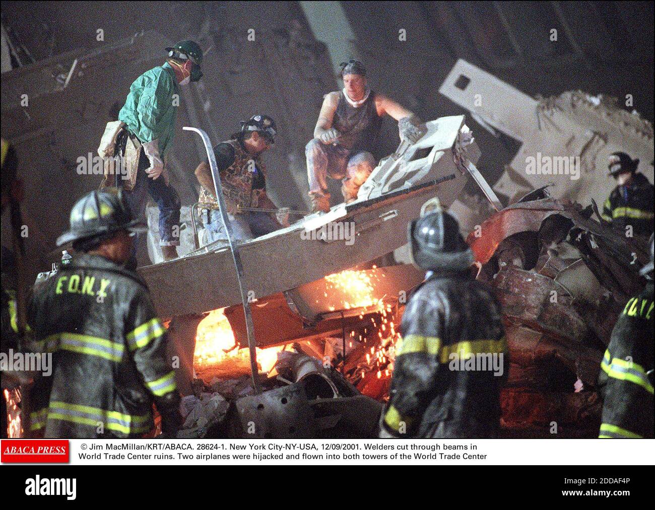 NO FILM, NO VIDEO, NO TV, NO DOCUMENTARY - © Jim MacMillan/KRT/ABACA. 28624-1. New York City-NY-USA, 12/09/2001. Welders cut through beams in World Trade Center ruins. Two airplanes were hijacked and flown into both towers of the World Trade Center Stock Photo