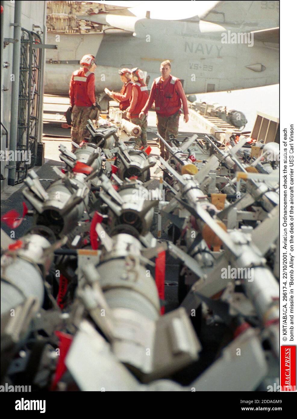 NO FILM, NO VIDEO, NO TV, NO DOCUMENTARY - © KRT/ABACA. 29617-4. 22/10/2001. Aviation Ordnancemen check the status of each bomb and missile in Bomb Alley on the deck of the aircraft carrier USS Carl Vinson Stock Photo