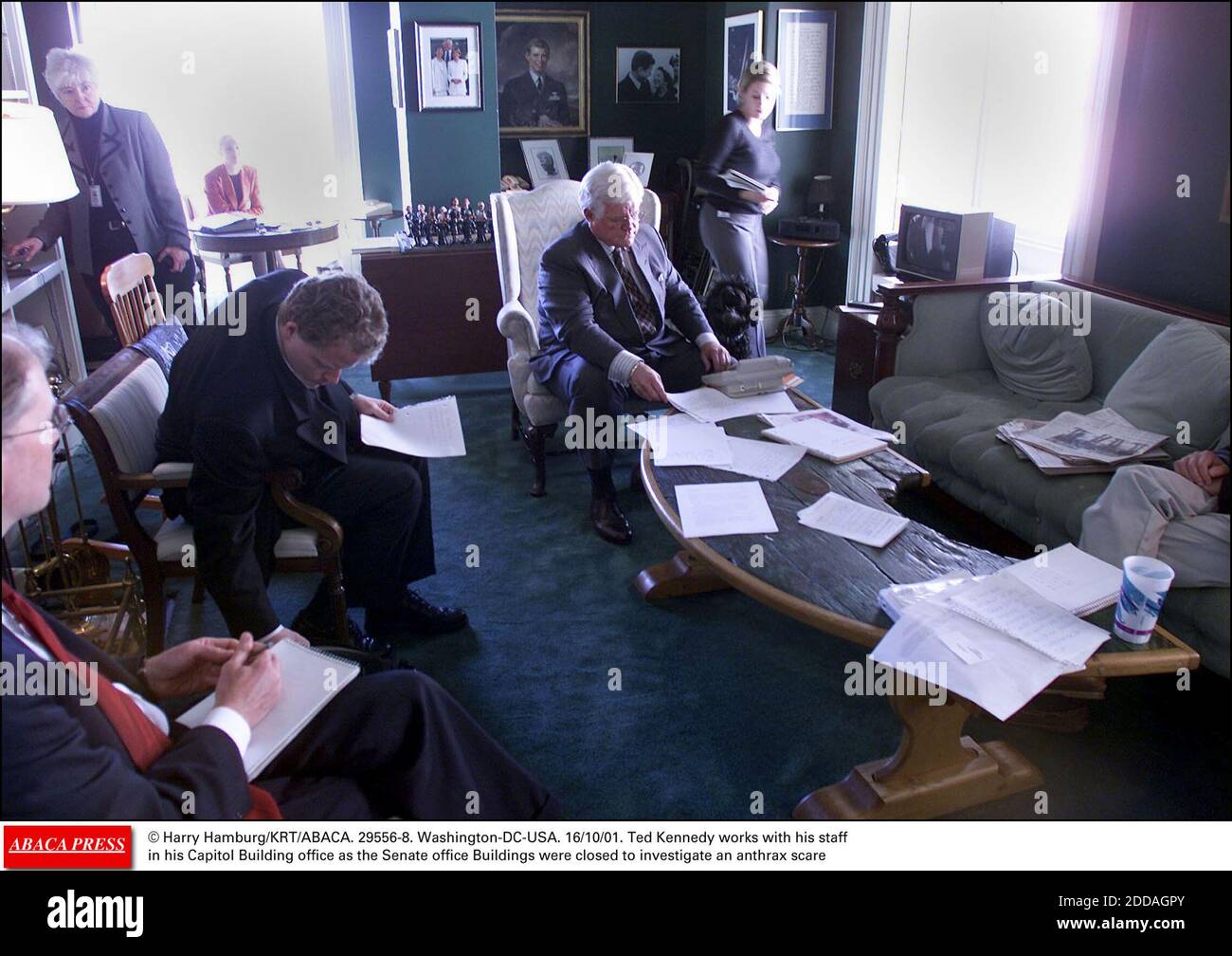 NO FILM, NO VIDEO, NO TV, NO DOCUMENTARY - © Harry Hamburg/KRT/ABACA. 29556-8. Washington-DC-USA. 16/10/01. Ted Kennedy works with his staff in his Capitol Building office as the Senate office Buildings were closed to investigate an anthrax scare Stock Photo