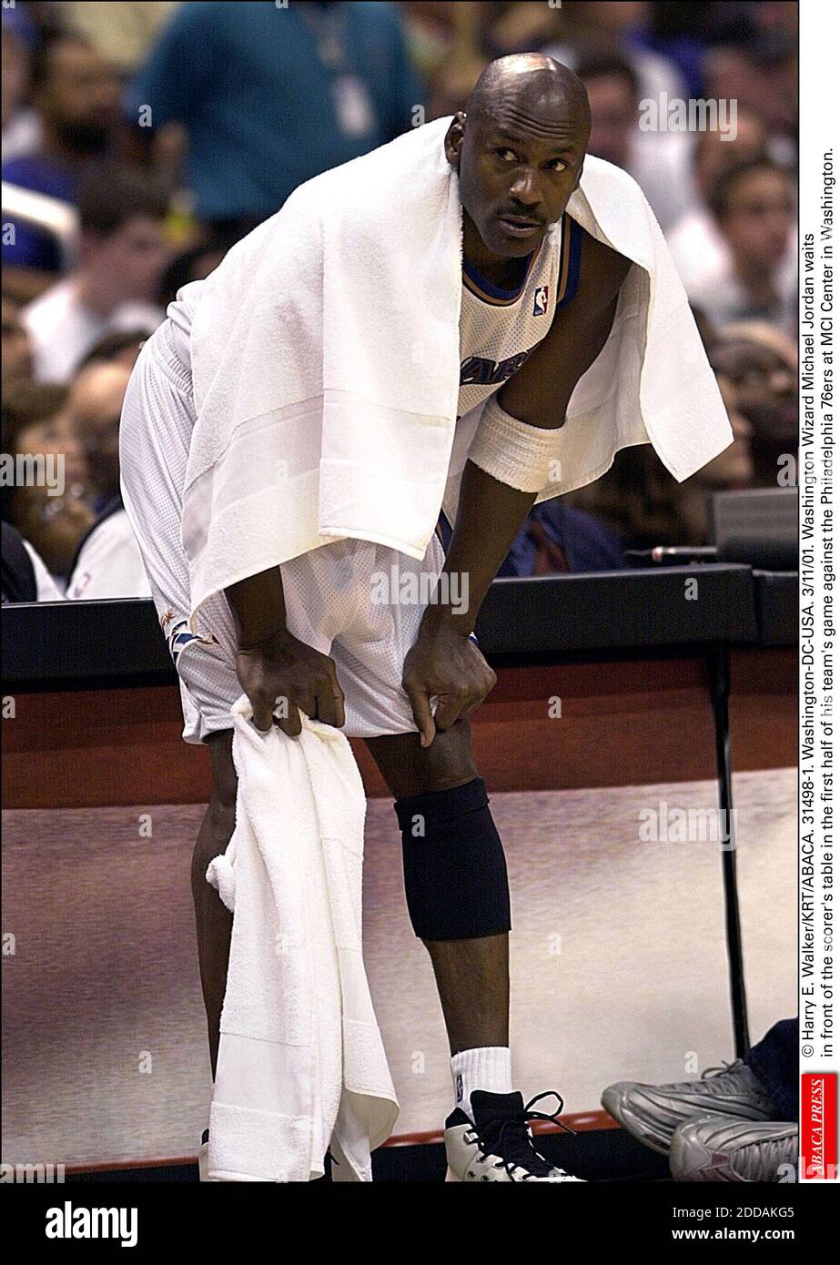 NO FILM, NO VIDEO, NO TV, NO DOCUMENTARY - © Harry E. Walker/KRT/ABACA. 31498-1. Washington-DC-USA. 3/11/01. Washington Wizard Michael Jordan waits in front of the scorer's table in the first half of his team's game against the Philadelphia 76ers at MCI Center in Washington. Stock Photo
