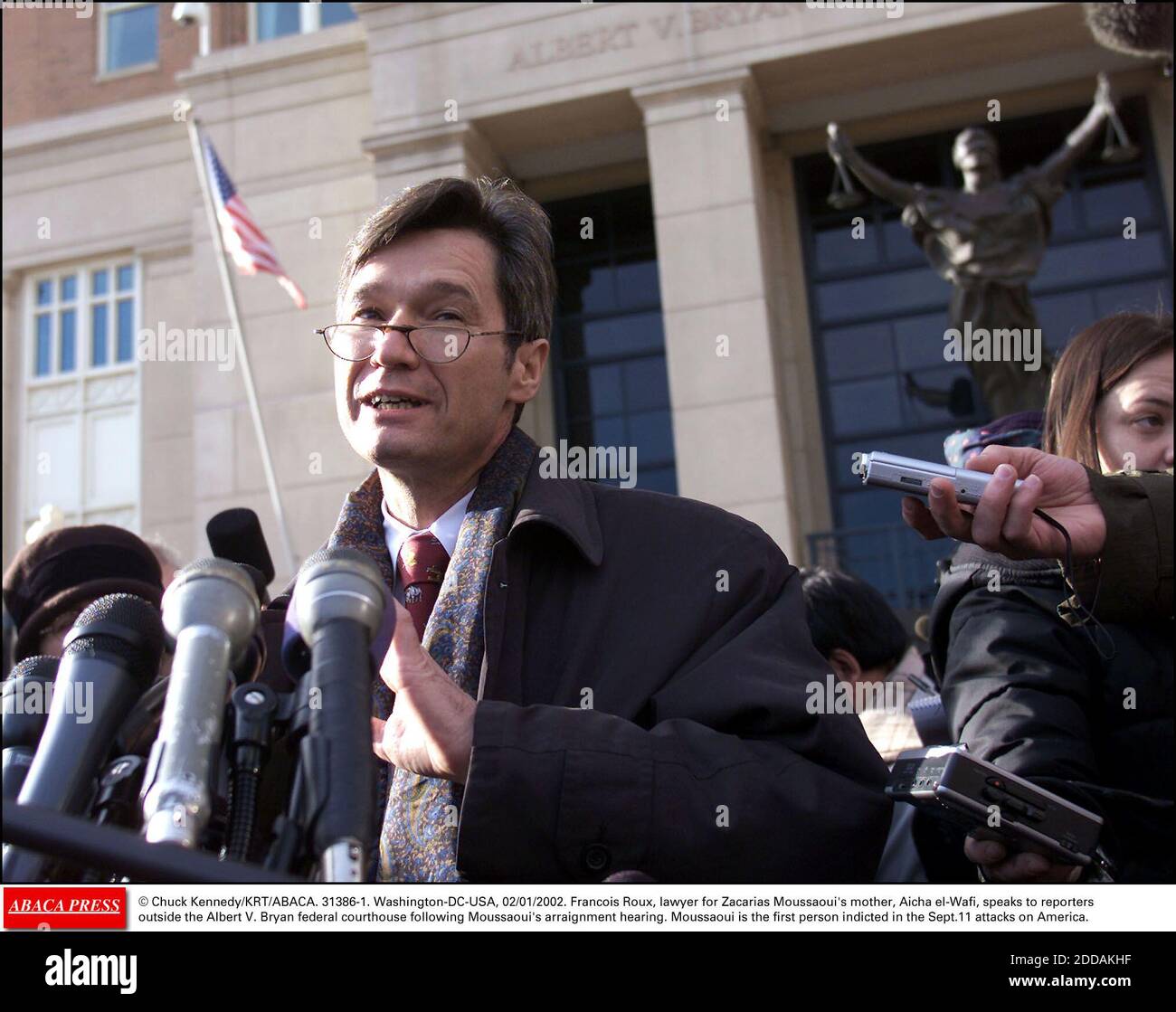 NO FILM, NO VIDEO, NO TV, NO DOCUMENTARY - © Chuck Kennedy/KRT/ABACA. 31386-1. Washington-DC-USA, 02/01/2002. Francois Roux, lawyer for Zacarias Moussaoui's mother, Aicha el-Wafi, speaks to reporters outside the Albert V. Bryan federal courthouse following Moussaoui's arraignment hearing. Moussaou Stock Photo