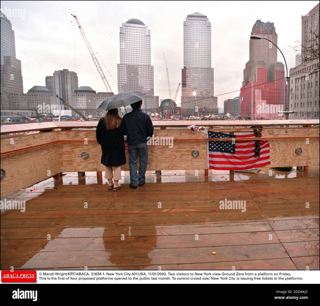 NO FILM, NO VIDEO, NO TV, NO DOCUMENTARY - © Mandi Wright/KRT/ABACA. 31834-1. New York City-NY-USA. 11/01/2002. Two visitors to New York view Ground Zero from a platform on Friday, January 11, 2002 This is the first of four proposed platforms opened to the public last month. To control crowd size, Stock Photo