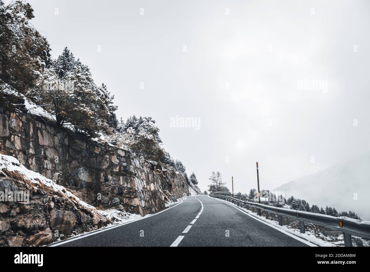 Empty alpine highway in winter Stock Photo