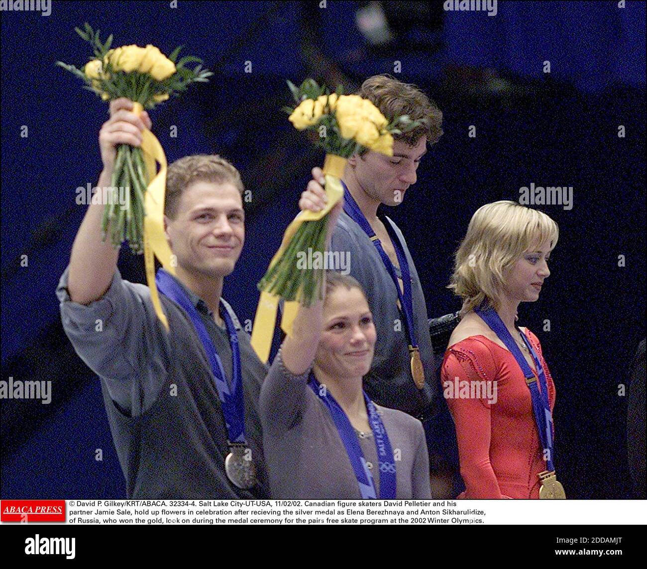 NO FILM, NO VIDEO, NO TV, NO DOCUMENTARY - © David P. Gilkey/KRT/ABACA. 32334-4. Salt Lake City-UT-USA, 11/02/02. Canadian figure skaters David Pelletier and his partner Jamie Sale, hold up flowers in celebration after recieving the silver medal as Elena Berezhnaya and Anton Sikharulidize, of Russ Stock Photo
