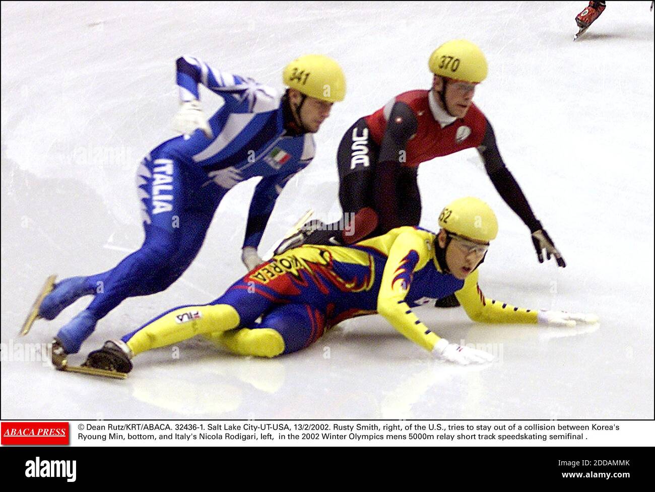 NO FILM, NO VIDEO, NO TV, NO DOCUMENTARY - © Dean Rutz/KRT/ABACA. 32436-1. Salt Lake City-UT-USA, 13/2/2002. Rusty Smith, right, of the U.S., tries to stay out of a collision between Korea's Ryoung Min, bottom, and Italy's Nicola Rodigari, left, in the 2002 Winter Olympics mens 5000m relay short t Stock Photo