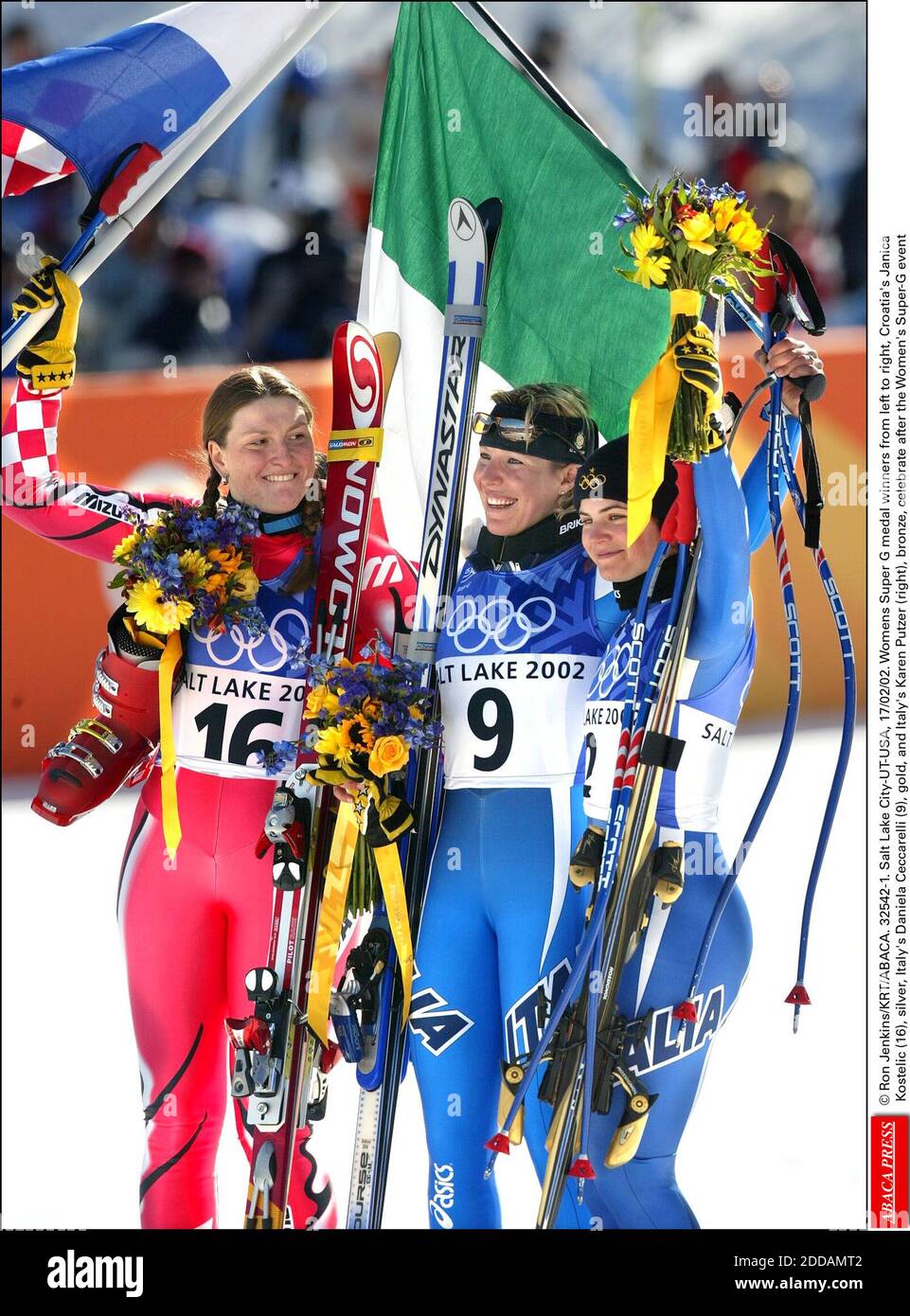 NO FILM, NO VIDEO, NO TV, NO DOCUMENTARY - © Ron Jenkins/KRT/ABACA. 32542-1. Salt Lake City-UT-USA, 17/02/02. Womens Super G medal winners from left to right, Croatia's Janica Kostelic (16), silver, Italy's Daniela Ceccarelli (9), gold, and Italy's Karen Putzer (right), bronze, celebrate after the Stock Photo