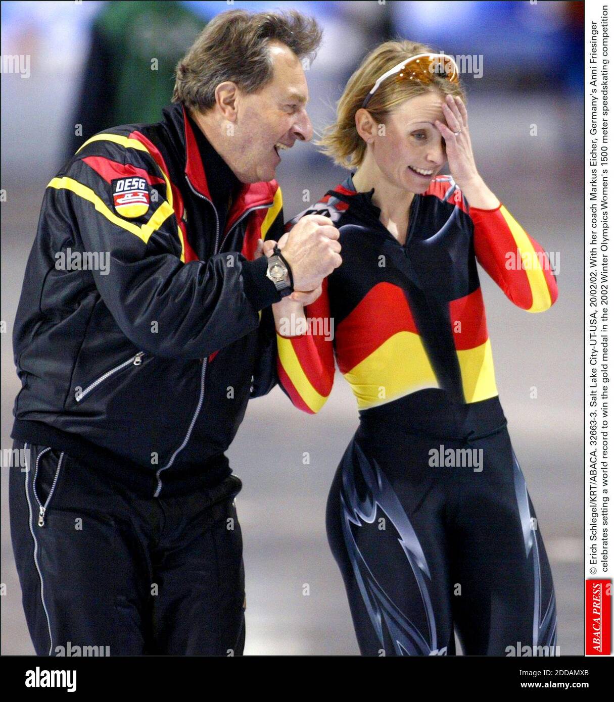 NO FILM, NO VIDEO, NO TV, NO DOCUMENTARY - © Erich Schlegel/KRT/ABACA. 32663-3. Salt Lake City-UT-USA, 20/02/02. With her coach Markus Eicher, Germany's Anni Friesinger celebrates setting a world record to win the gold medal in the 2002 Winter Olympics Women's 1500 meter speedskating competition Stock Photo