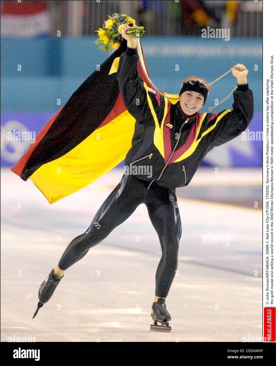 NO FILM, NO VIDEO, NO TV, NO DOCUMENTARY - © John Doman/KRT/ABACA. 32665-1. Salt Lake City-UT-USA, 17/02/02. Germany's Anni Freisinger takes a victory lap after capturing the gold medal and setting a world record in the 2002 Winter Olympics Women's 1500 meter speedskating competition at the Utah O Stock Photo