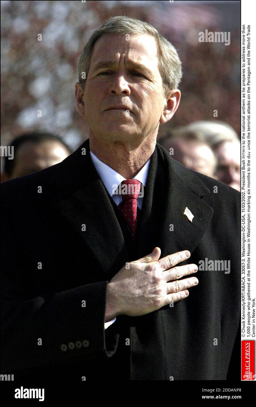 NO FILM, NO VIDEO, NO TV, NO DOCUMENTARY - © Chuck Kennedy/KRT/ABACA. 33057-3. Washington-DC-USA, 11/03/2002. President Bush listens to the national anthem as he prepares to address more than 1,000 people who gathered at the White House in Washington marking six months to the day since the terrori Stock Photo