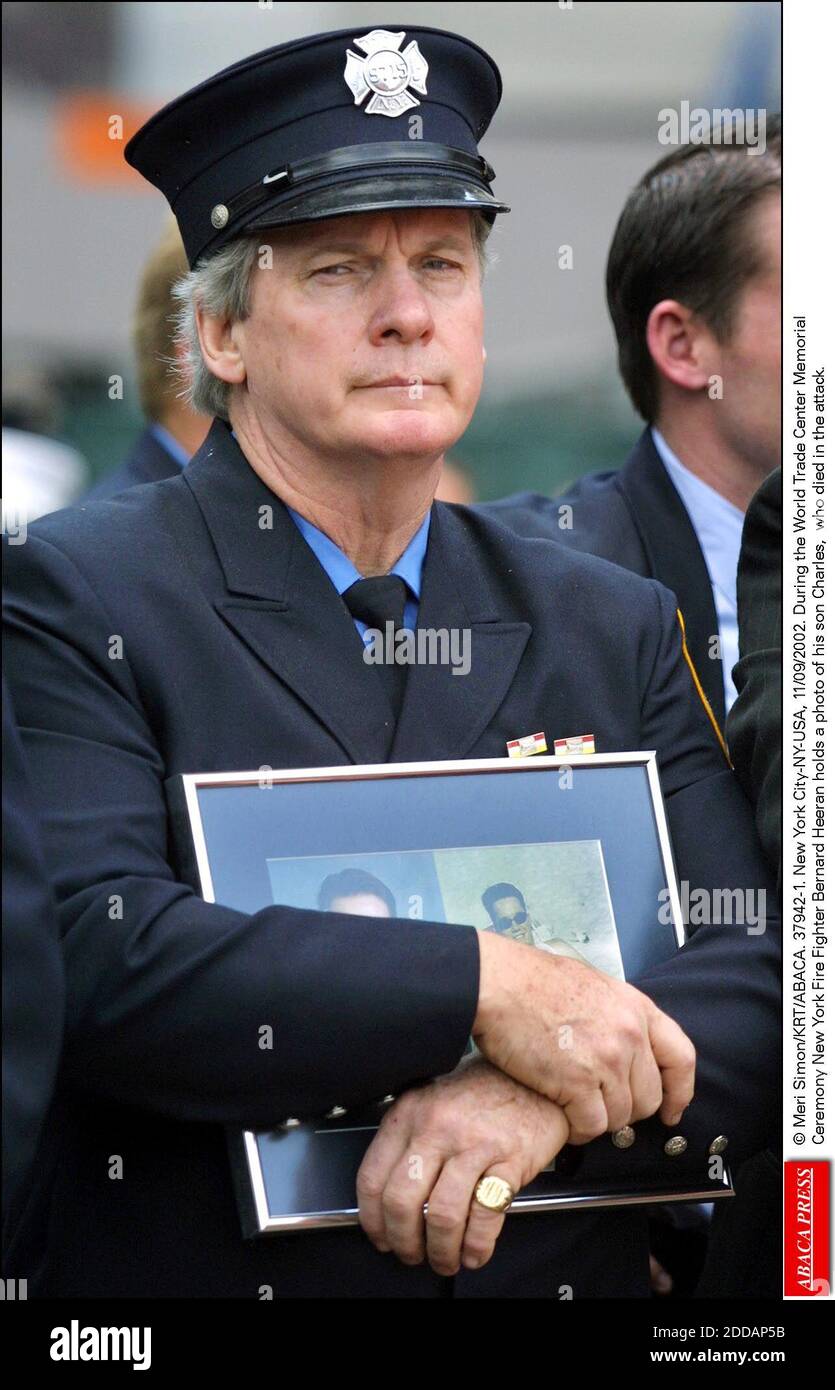 NO FILM, NO VIDEO, NO TV, NO DOCUMENTARY - © Meri Simon/KRT/ABACA. 37942-1. New York City-NY-USA, 11/09/2002. During the World Trade Center MemorialCeremony New York Fire Fighter Bernard Heeran holds a photo of his son Charles, who died in the attack. Stock Photo