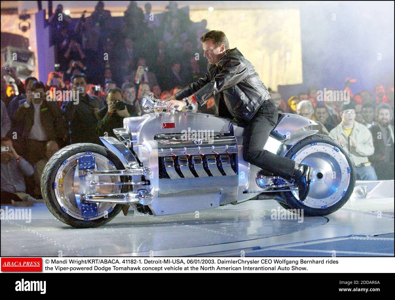 NO FILM, NO VIDEO, NO TV, NO DOCUMENTARY - © Mandi Wright/KRT/ABACA. 41182-1. Detroit-MI-USA, 06/01/2003. DaimlerChrysler CEO Wolfgang Bernhard rides the Viper-powered Dodge Tomahawk concept vehicle at the North American Interantional Auto Show. Stock Photo