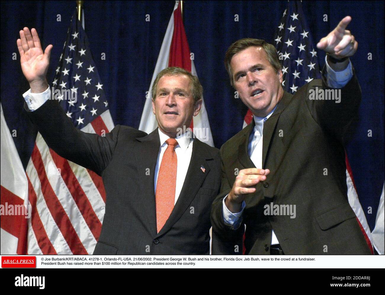 NO FILM, NO VIDEO, NO TV, NO DOCUMENTARY - File photo : © Joe Burbank/KRT/ABACA. 41278-1. Orlando-FL-USA. 21/06/2002. President George W. Bush and his brother, Florida Gov. Jeb Bush, wave to the crowd at a fundraiser. President Bush has raised more than $100 million for Republican candidates across the country Appearing before a raucous rally in front of thousands of supporters here Monday afternoon, former Florida governor Jeb Bush showed he is a force to be reckoned with in the presidential election as he officially launched his campaign. Stock Photo