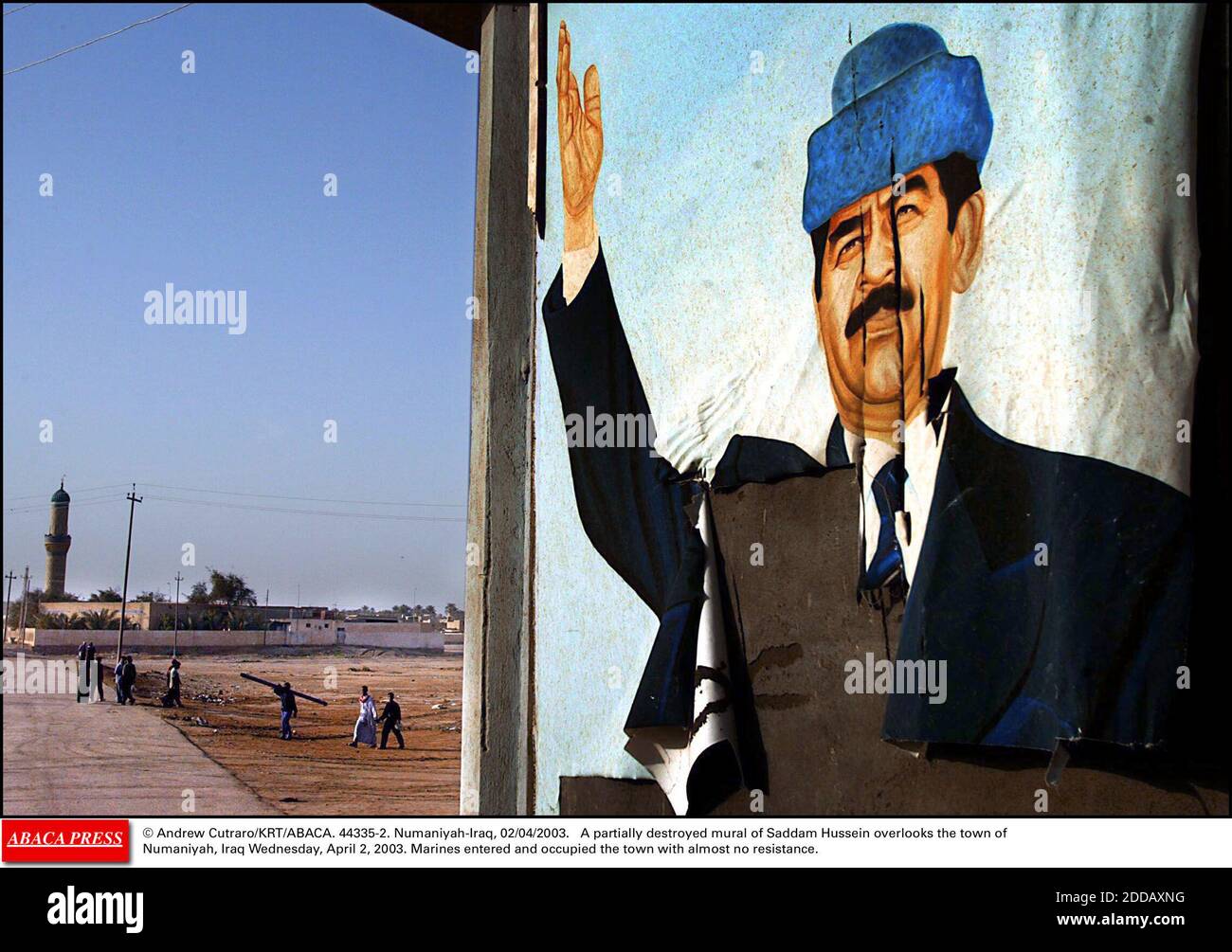 NO FILM, NO VIDEO, NO TV, NO DOCUMENTARY - © Andrew Cutraro/KRT/ABACA. 44335-2. Numaniyah-Iraq, 02/04/2003. A partially destroyed mural of Saddam Hussein overlooks the town of Numaniyah, Iraq Wednesday, April 2, 2003. Marines entered and occupied the town with almost no resistance. Stock Photo