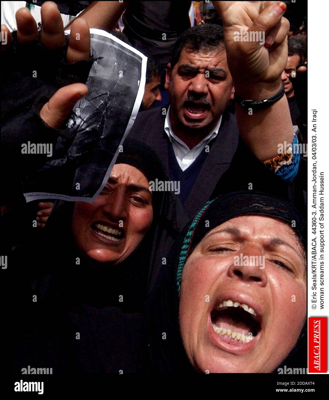 NO FILM, NO VIDEO, NO TV, NO DOCUMENTARY - © Eric Seals/KRT/ABACA. 44360-3. Amman-Jordan, 04/03/03. An Iraqi woman screams support of Saddam Stock Photo - Alamy