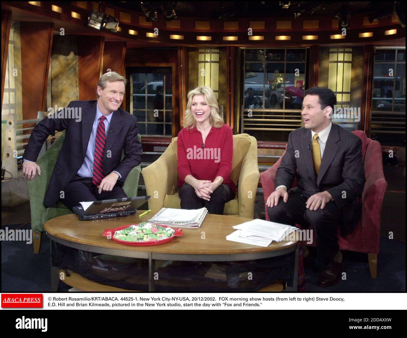 NO FILM, NO VIDEO, NO TV, NO DOCUMENTARY - © Robert Rosamilio/KRT/ABACA. 44525-1. New York City-NY-USA, 20/12/2002. FOX morning show hosts (from left to right) Steve Doocy, E.D. Hill and Brian Kilmeade, pictured in the New York studio, start the day with Fox and Friends. Stock Photo