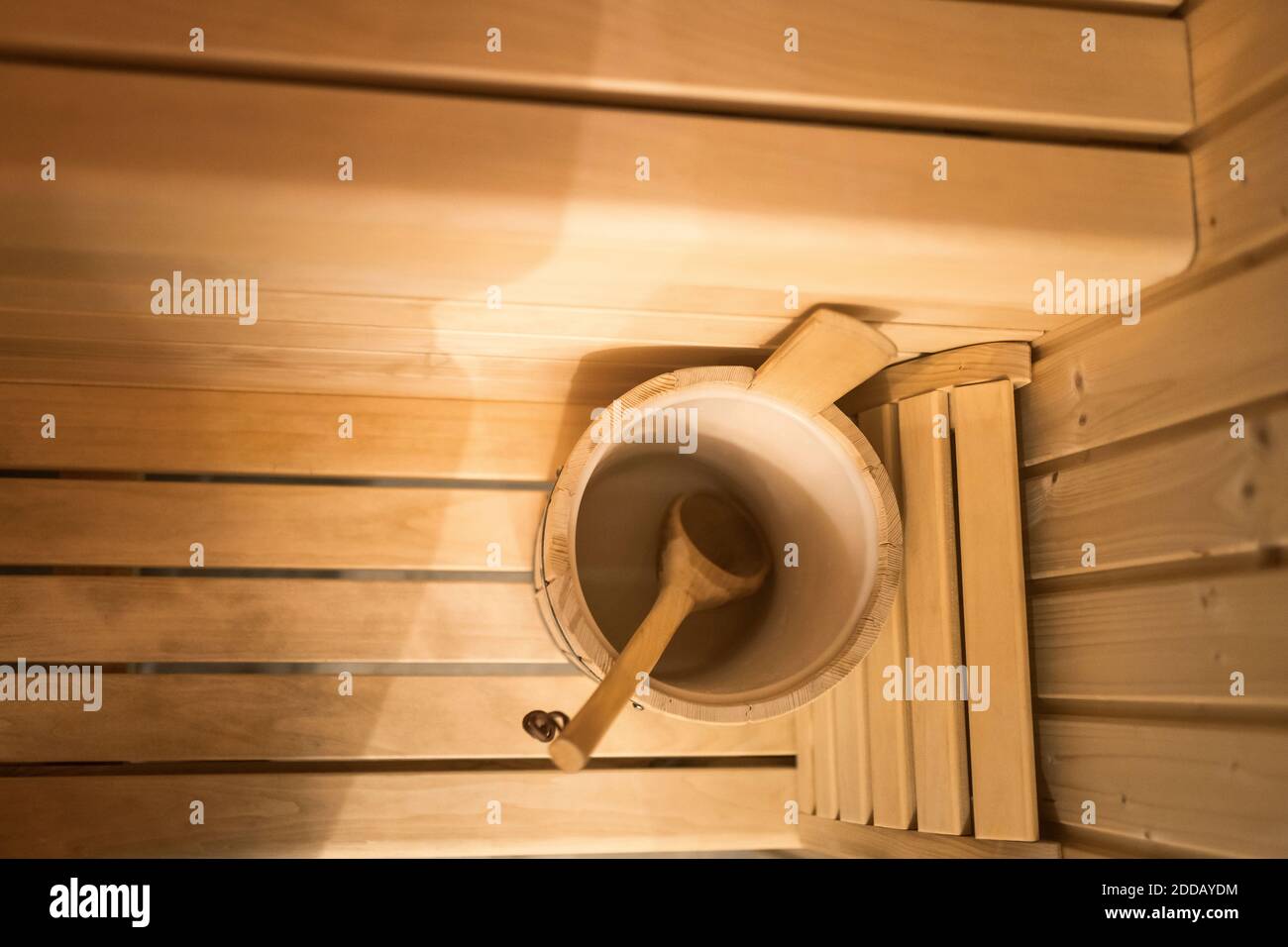 Bucket and wooden spoon in sauna Stock Photo Alamy