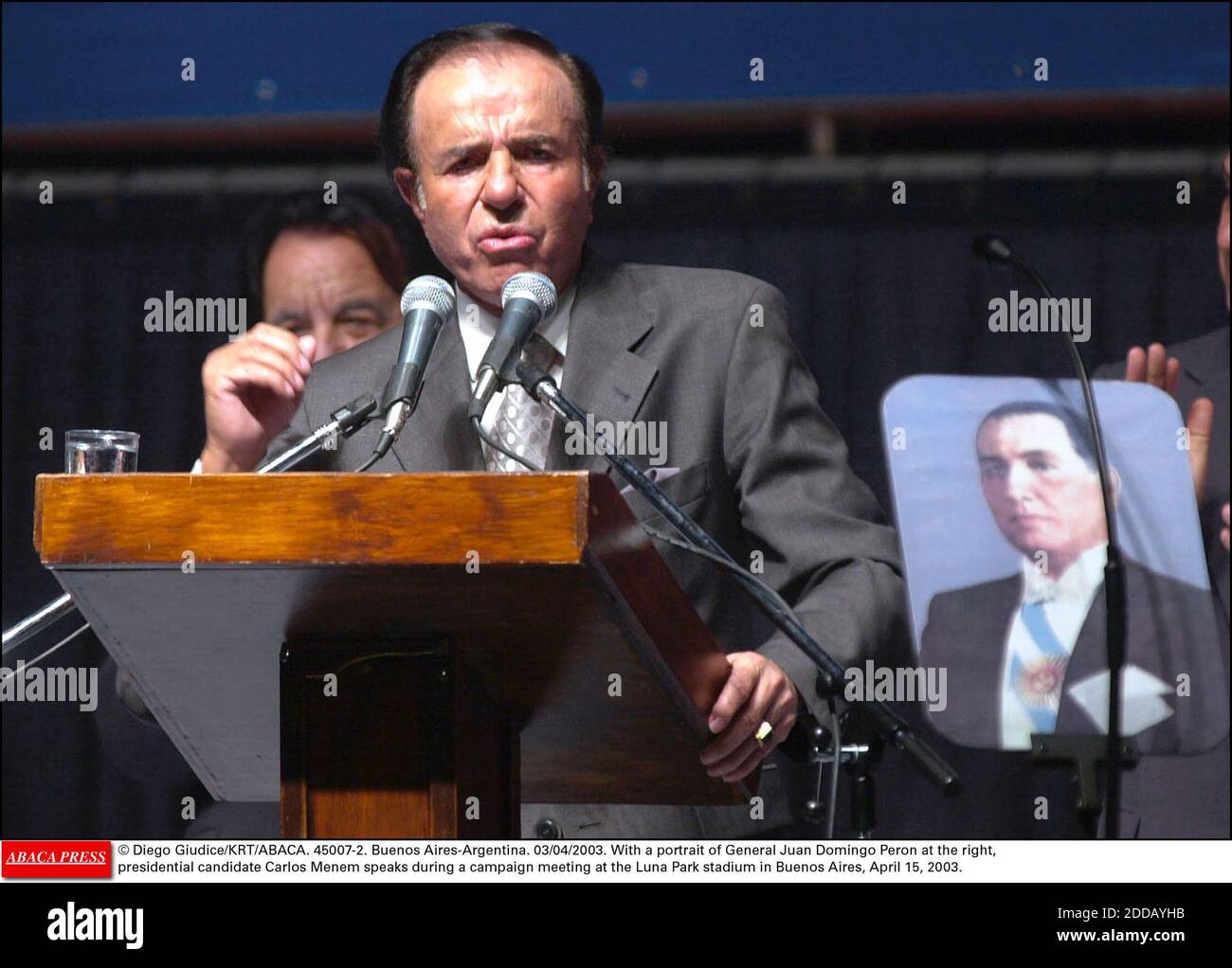 NO FILM, NO VIDEO, NO TV, NO DOCUMENTARY - © Diego Giudice/KRT/ABACA. 45007-2. Buenos Aires-Argentina. 15/04/2003. With a portrait of General Juan Domingo Peron at the right, presidential candidate Carlos Menem speaks during a campaign meeting at the Luna Park stadium in Buenos Aires, April 15, 20 Stock Photo
