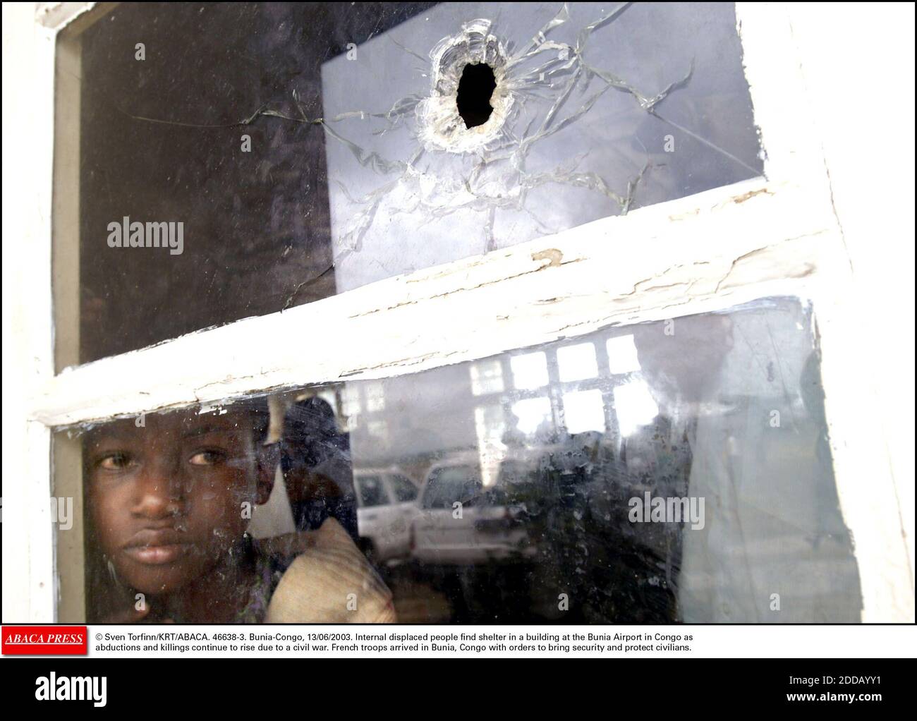 NO FILM, NO VIDEO, NO TV, NO DOCUMENTARY - © Sven Torfinn/KRT/ABACA. 46638-3. Bunia-Congo, 13/06/2003. Internal displaced people find shelter in a building at the Bunia Airport in Congo as abductions and killings continue to rise due to a civil war. French troops arrived in Bunia, Congo with order Stock Photo