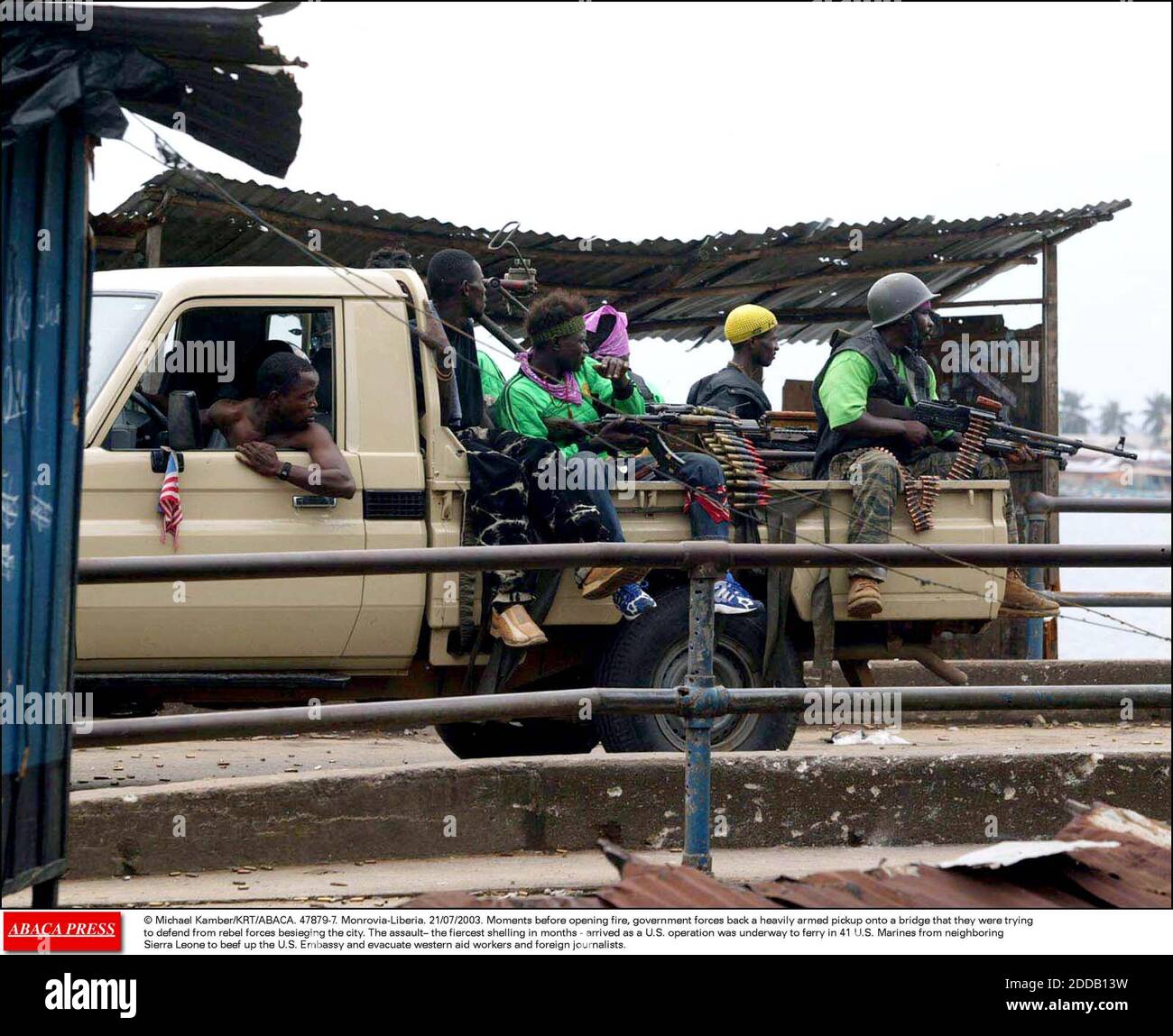 NO FILM, NO VIDEO, NO TV, NO DOCUMENTARY - © Michael Kamber/KRT/ABACA. 47879-7. Monrovia-Liberia. 21/07/2003. Moments before opening fire, government forces back a heavily armed pickup onto a bridge that they were trying to defend from rebel forces besieging the city. The assault  the fiercest she Stock Photo